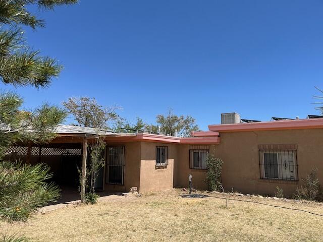 8.5kWH solar ($17K value) conveys F&C. Spectacular view of Sandia/Jemez Mountains and ABQ city lights from raised LR. Large handyman needs paint, carpet throughout. Room for add'l BR in south half of huge LR.  Large lot for potential home expansion. Nearly 700 sf of undeveloped walk-out basement space opens onto back yard and potential patio views. At estate appraisal price, maybe the cheapest view in town! 1940's sink and cabinet suite needs a kitchen upgrade, but hall bath boasts both tub and shower and newer tile. Owner in assisted living and heirs selling ''as is'' with No Repairs, No Disclosures, so verify listing info and full home inspection is strongly recommended! Convenient to bus and Old Town shopping and dining. Plus additional lot, no access, not valued in appraisal price!