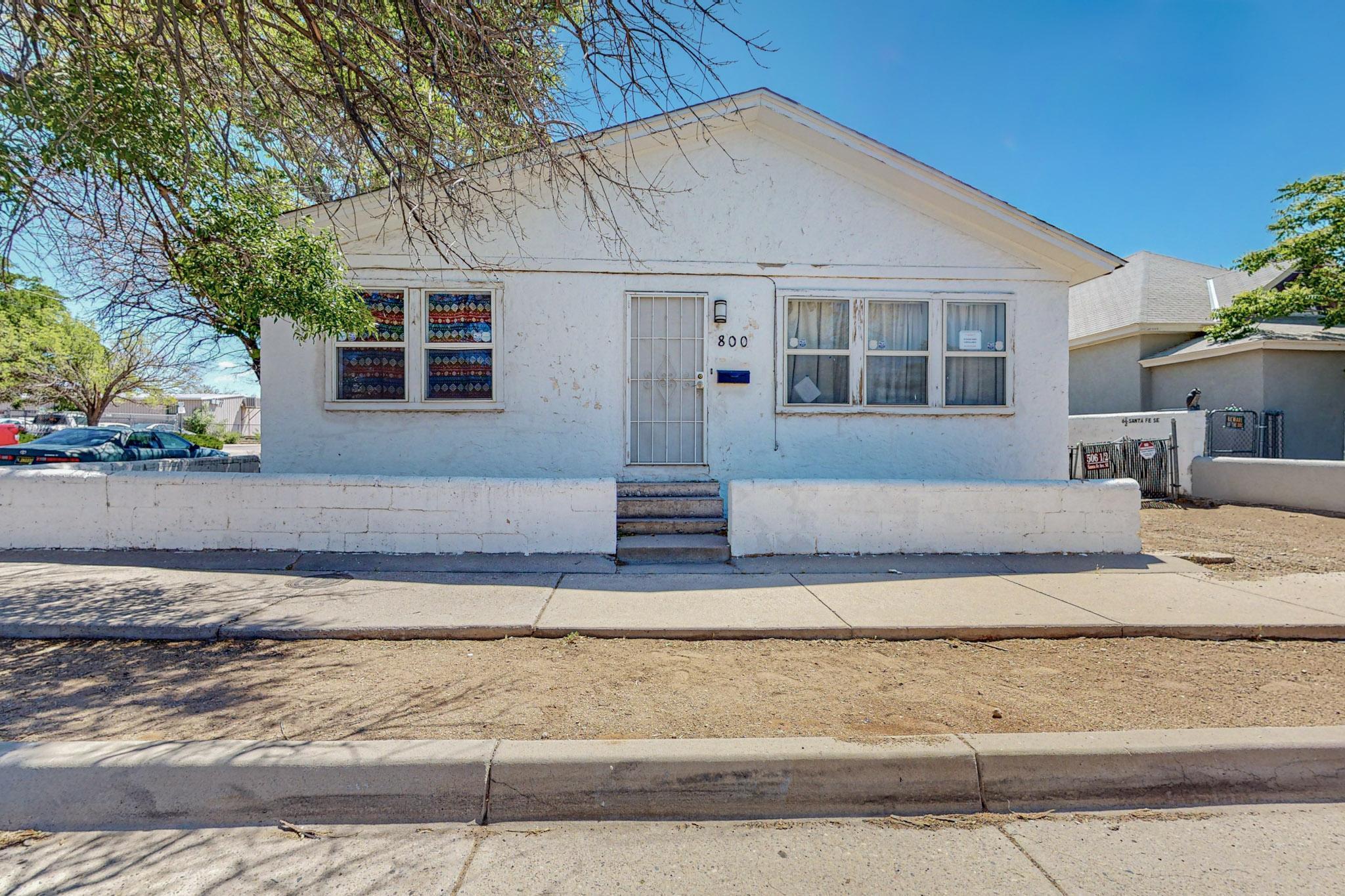 Welcome to a great investment opportunity in the heart of Albuquerque's historic downtown district.  This 4 bedroom 1 bathroom property is positioned on a corner lot.  The property spans a generous layout, ensuring ample space for tenants to live comfortably.  This downtown location and proximity to essential amenities, including schools, and restaurants including public transportation.  This property is more than just a property, it's a chance to own  a piece of Albuquerque's history while securing a reliable income stream.