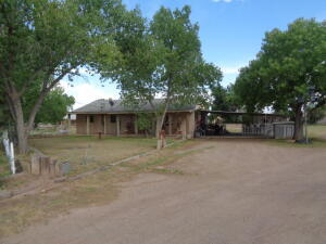 Wow! 3.17 acres on Sichler Road! Very desirable, upscale location! Country living with a nostalgic feel for simpler times. Close access to shopping, schools and highway! The best of both worlds in the heart of Los Lunas! Adorable home brimming with potential! Open floorplan perfect for living and entertaining! Nice natural light and abundance of counter space in Kitchen. Large, covered patio, gazebo, water feature and carport! Separate studio/casita with electricity.  Dream Workshop/Garage 40x40 has 220 electric, full auto paint spray booth, air compressor, heated and cooled!!! Hurry!!!