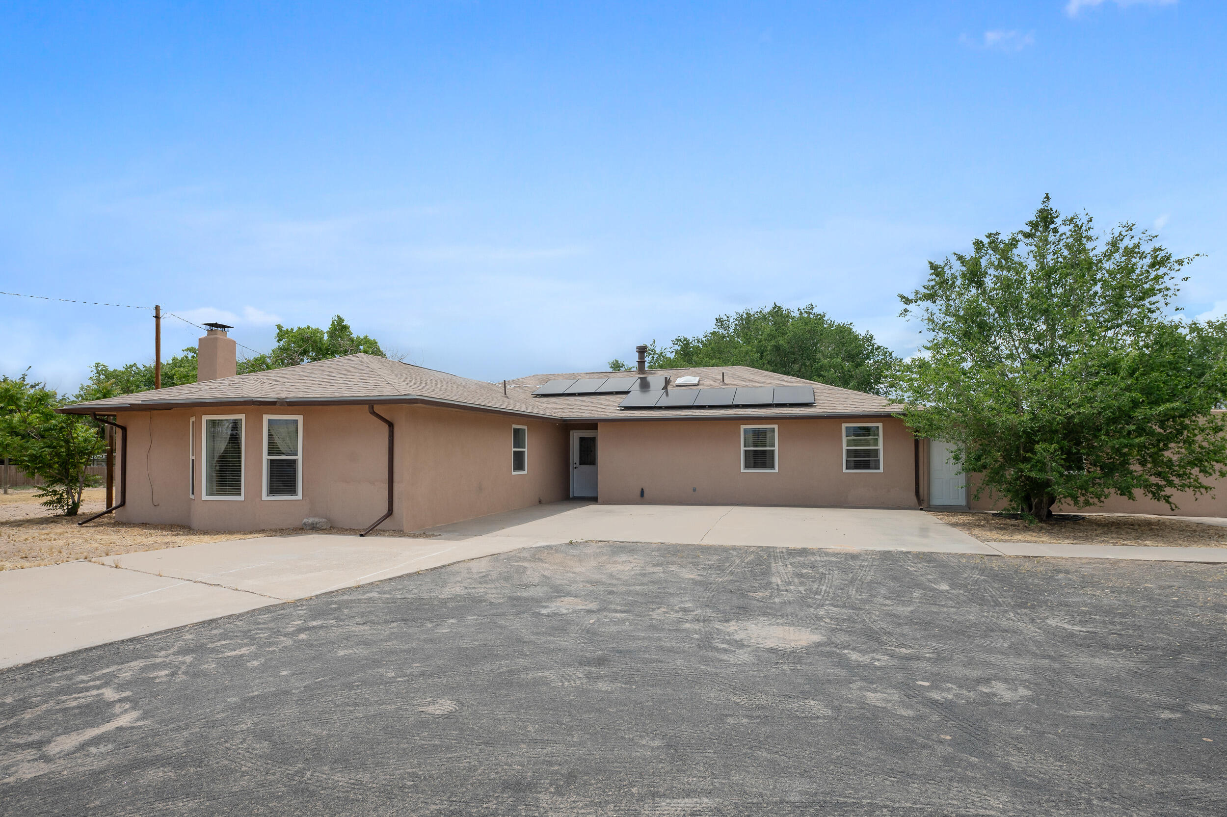 Spectacular home located just south of the UNM Valencia campus and away from the hustle and bustle of the city.  You'll enjoy seeing the pride of ownership radiating through out this home.  The home showcases a large kitchen with updated cabinets and a kitchen bar that overlooks the living room.  Additionally, the large family room offers extra living space with a wood burning fireplace.  Both areas provide excellent space to entertain family and friends.  Enjoy your morning coffee in the sun room or outdoor deck with a covered canopy.  Furthermore, you'll enjoy the refrigerated air for those hot summer days.  Lastly, the lot is big enough to give you the extra space you need but not too big to maintain.  So don't delay, schedule your showing today!
