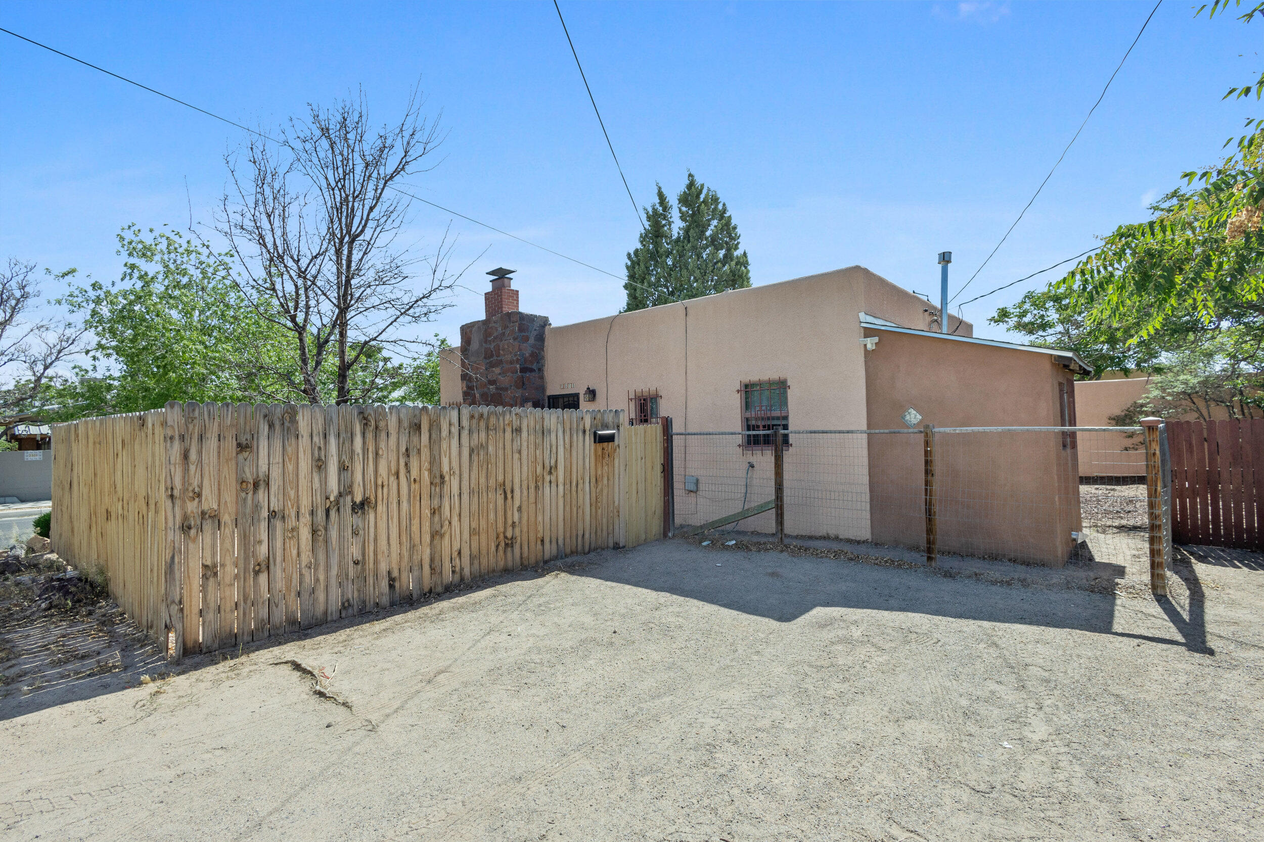 Charming 2 Bedroom/ 1 Bathroom, with fireplace 3 blks from UNM, adjacent to Nob Hill, easy access to Downtown/Uptown/Airport/Kirtland AFB/Sandia Labs. Hardwood floors.  Off street parking for 2 cars. Fenced and walled backyard for privacy.