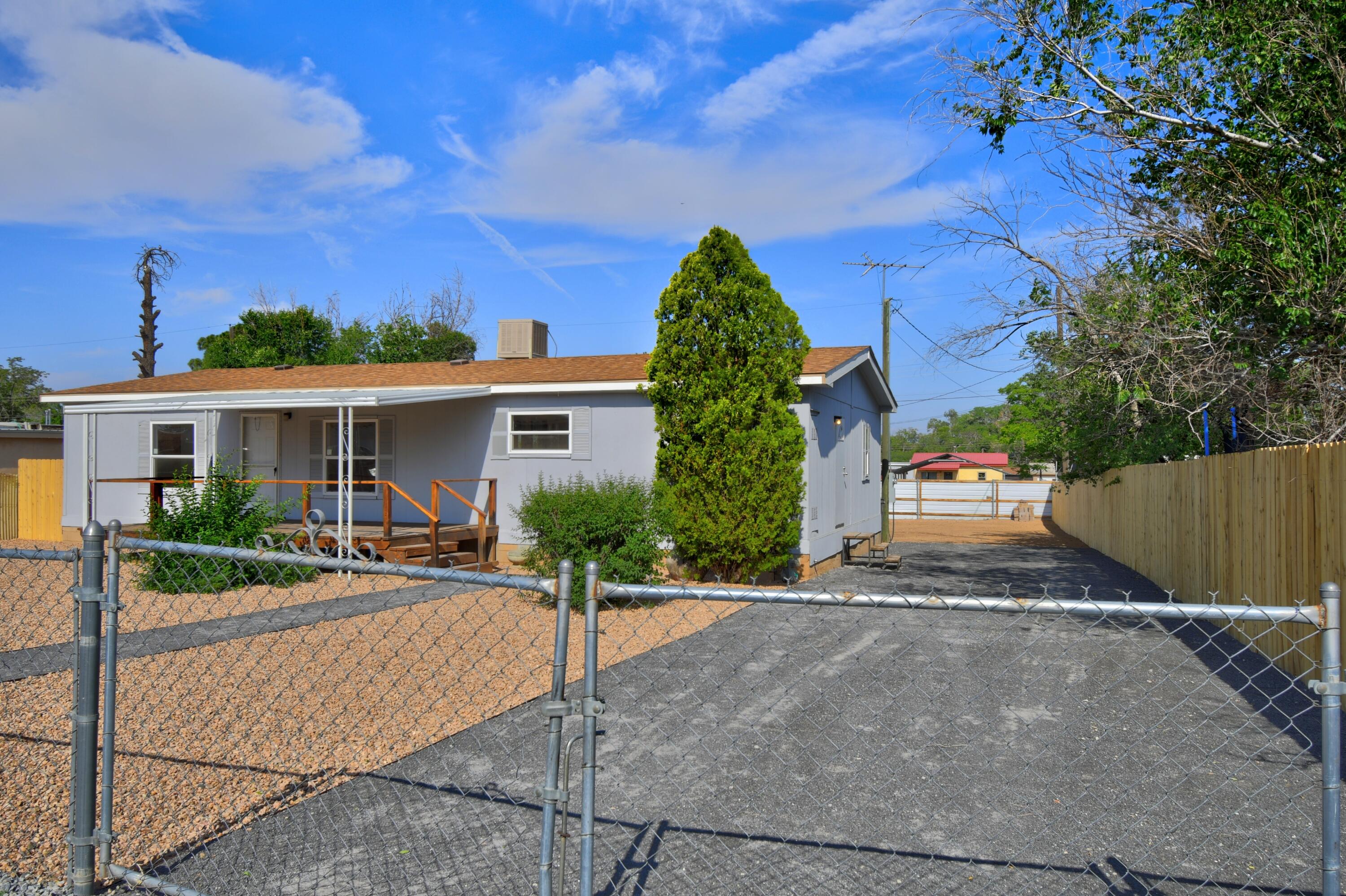 Location Location Location!  Situated on a fully fenced generous lot, this residence boasts ample space for outdoor activities, gardening, or potential 2nd dwelling. And with side yard access, you've got plenty of room for your toys. Step outside onto your front or back deck and soak in those sweet sunny days. Inside, you'll find not one, not two, but three bedrooms, all with walk-in closets. New roof, A/C, windows, flooring and paint. And the 2 full bathrooms? Oh, they've had a serious glow-up. Don't miss your chance to make this your home! Schedule a showing today!