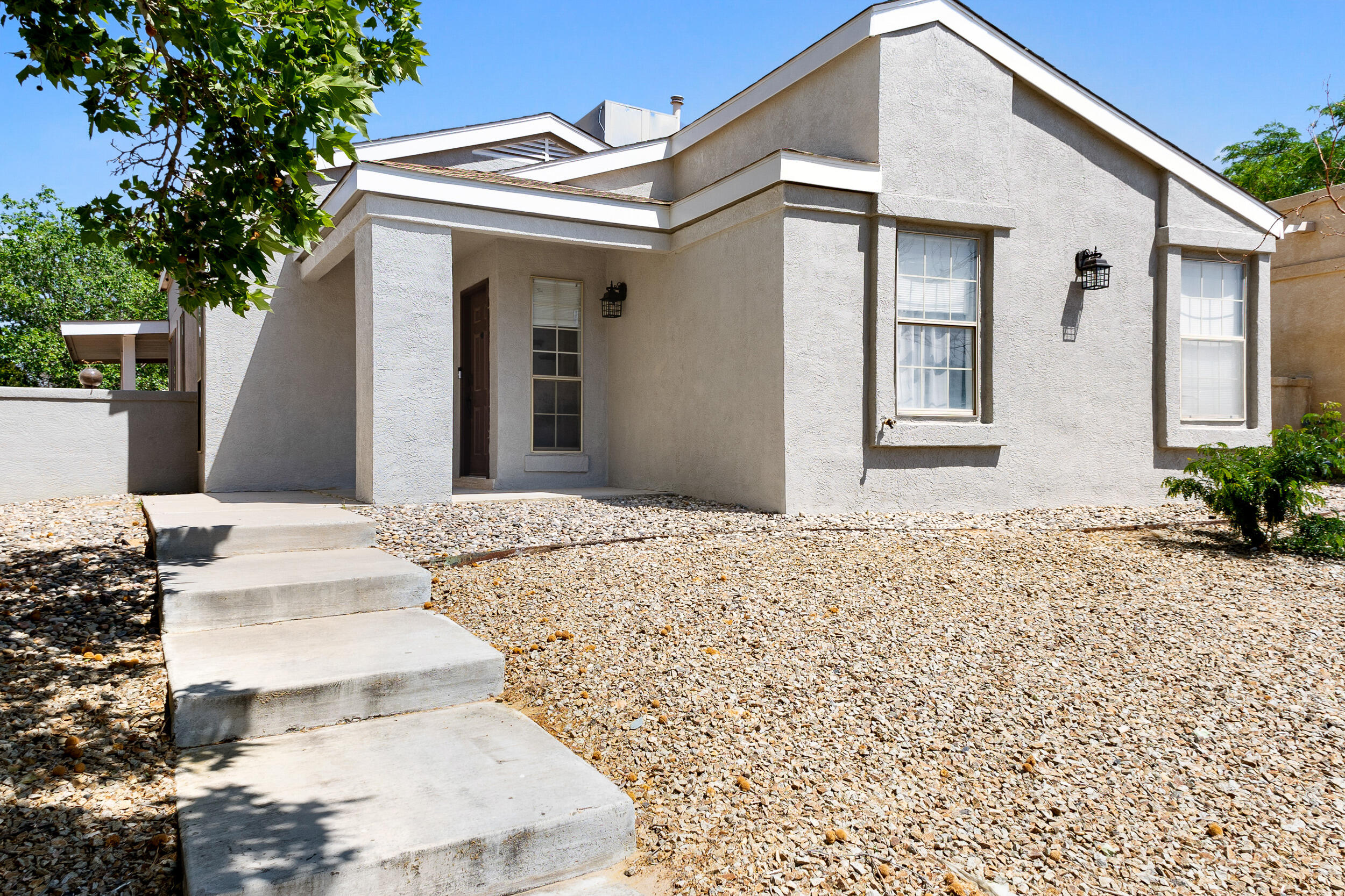 Welcome to this charming home in the heart of Rio Rancho! This beautiful 2 bedroom, 2 bath residence offers an inviting blend of comfort and modern style. Enjoy the airy, open feel of vaulted ceilings that enhance the spaciousness of the living room, making it an ideal space for relaxation and entertaining. Both bathrooms have been tastefully updated with tile up to the ceiling, providing a touch of luxury to your daily routine. The home's exterior has been freshly painted, offering great curb appeal and ensuring low maintenance for years to come. The attached 2-car garage includes a dedicated workshop area, perfect for DIY projects, hobbies, or extra storage. Come visit today!