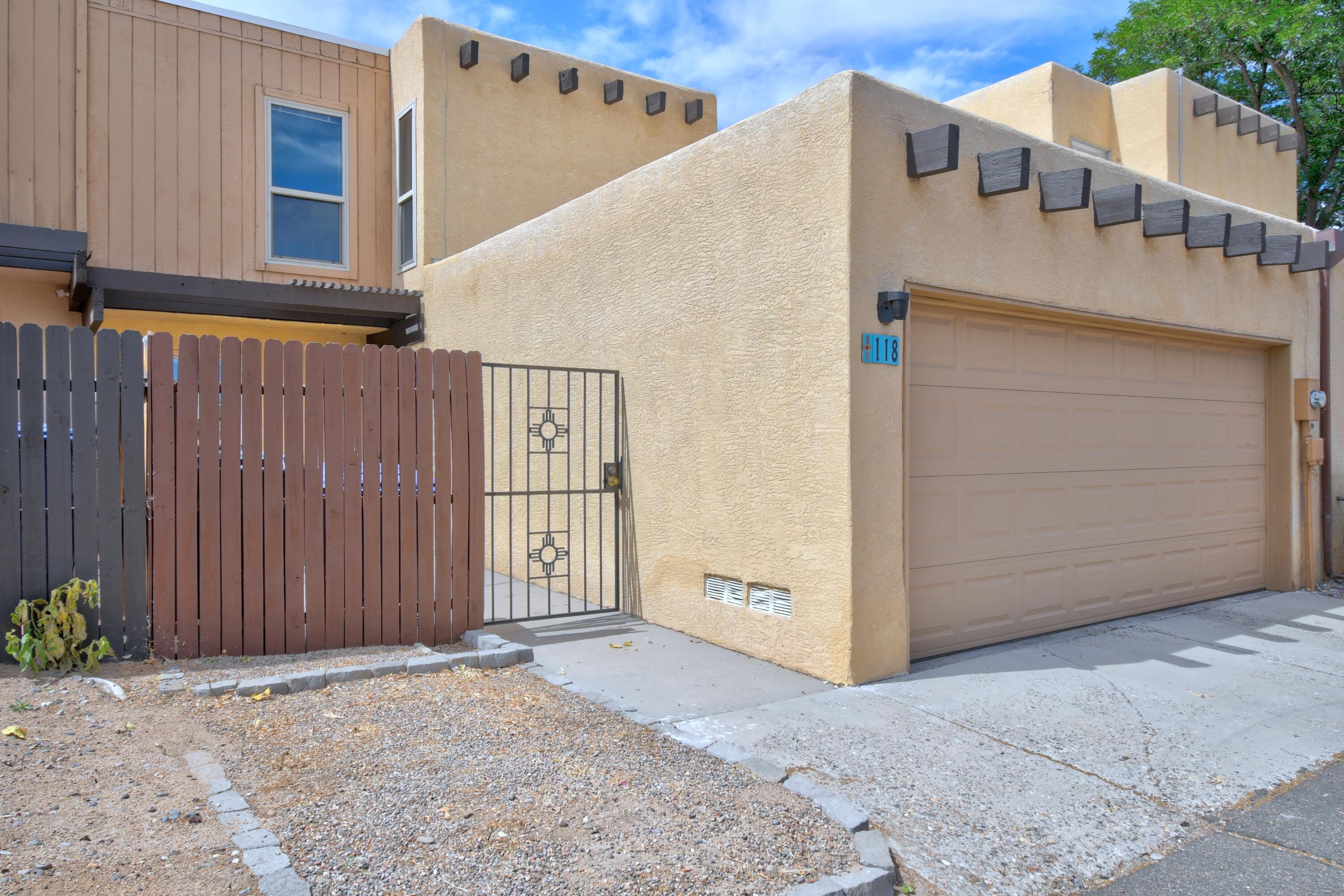 Enjoy this 3 bedroom/3 bath townhouse located in the Villa Encantada Community in Northeast Albuquerque. Close to Arroyo Del Oso Golf Course, shopping, healthcare and more. Easy access to Kirtland AFB and the free way for your commute. Kitchen opens to living space - private bedrooms located on second floor. Appliances (washer/dryer/fridge/stove) convey - Refrigerated Air - two car garage with spacious storage. The pool is open and ready to cool off.