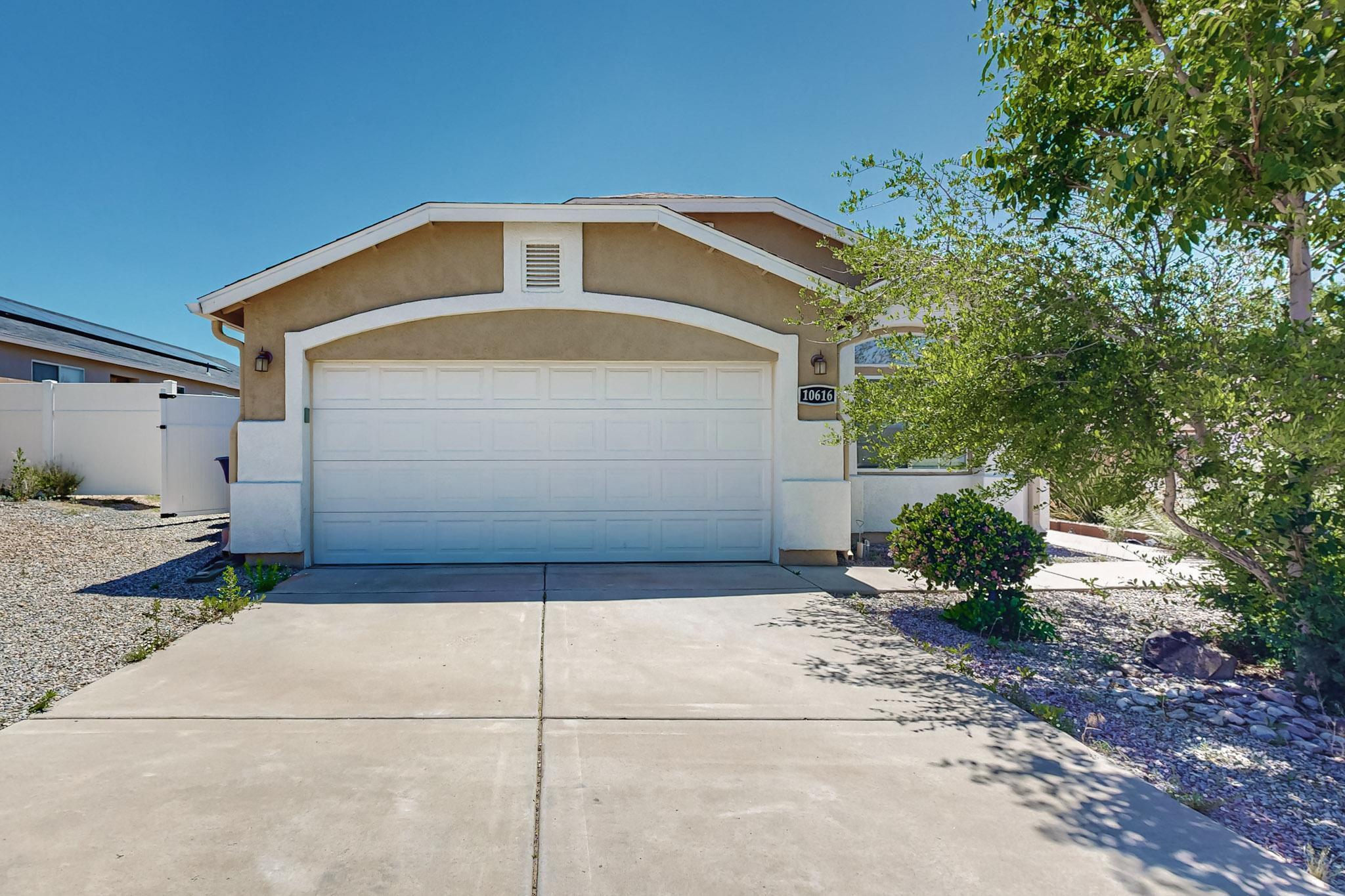 OPEN HOUSE SATURDAY JUNE 22 FROM 11:00-1:00 PM!!! NO HOA! Move-in ready 4-bedroom, 2-bath home boasts vaulted ceilings, and large windows make this home light and bright! The open kitchen features ample counter and cabinet space, a gas stove, fridge, and a breakfast bar. The family room includes a gas fireplace. The primary bedroom offers dual closets, dual sinks, and a tub/shower combo. Enjoy a large, private backyard, fully landscaped with a covered patio. Refrigerated A/C. Nearby top-rated schools, shopping at Unser Plaza, and beautiful parks like Paradise Skies and Seville Park.