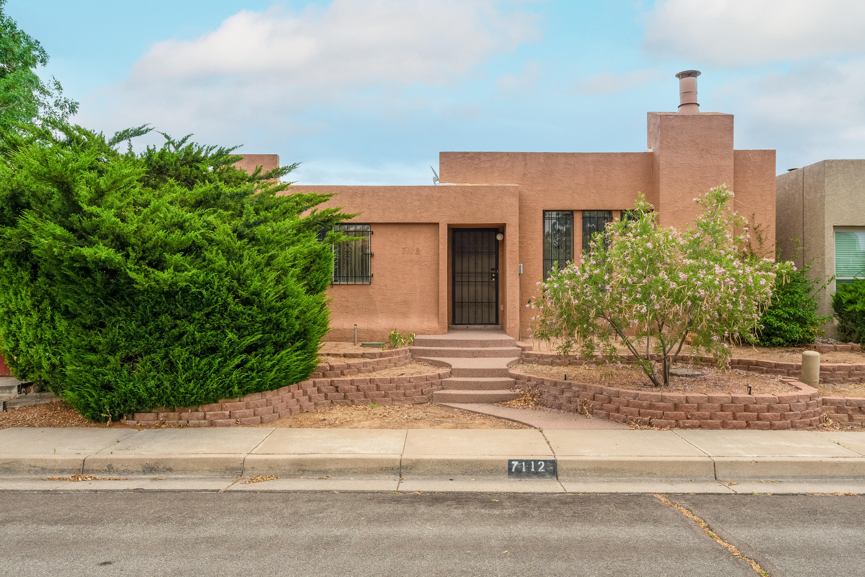 This La Cueva school district cutie is a total gem! This three bedroom, 2 bath, lovely little townhome is attached only at the garage, features a private courtyard and side yard, a 2 car garage, and a functional and open floor plan. With a little cosmetic glow up, this home will shine! Come take a look!