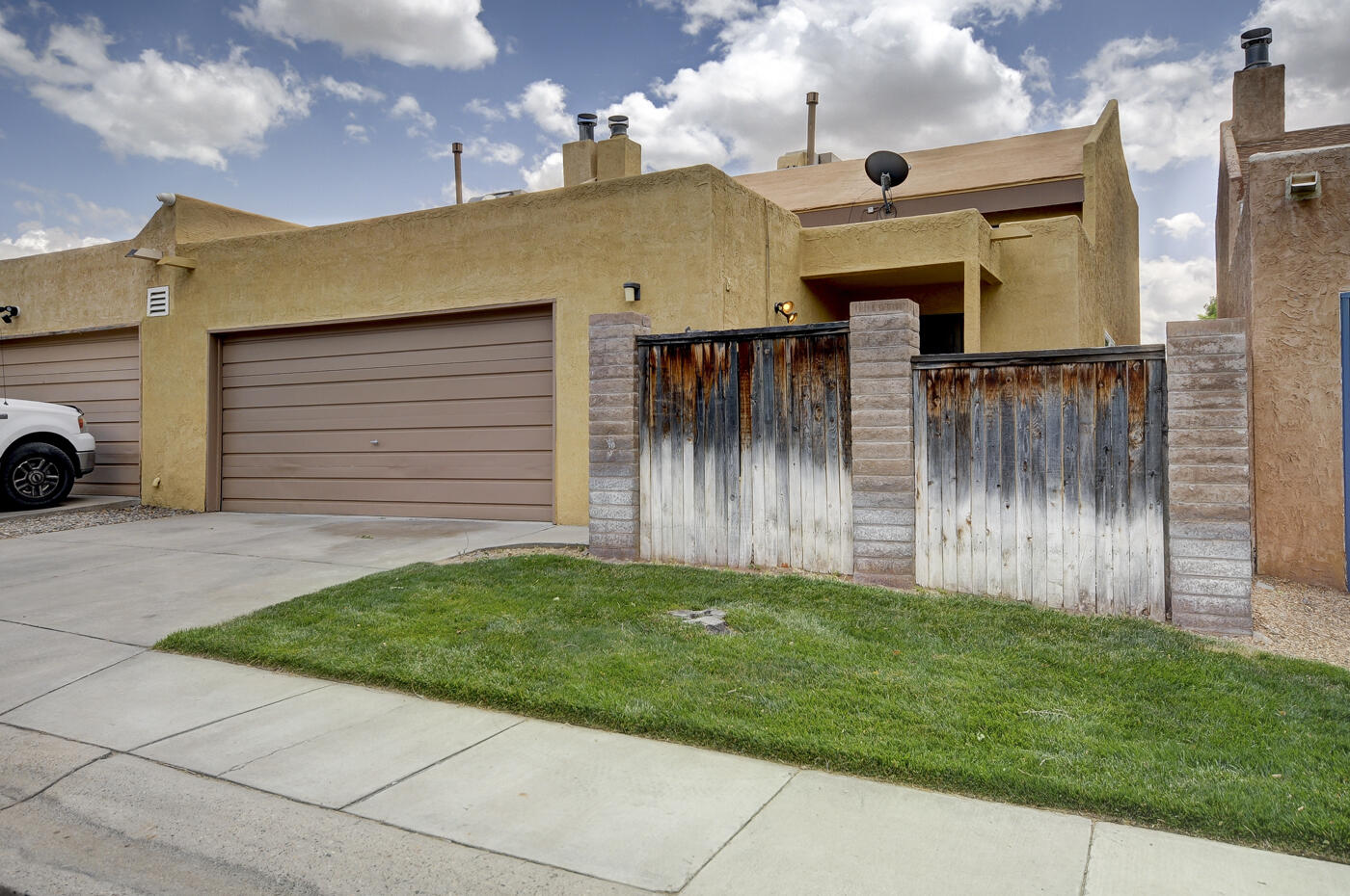 Welcome to this bright townhome in the Santa Barbara subdivision! Enjoy a spacious layout close to shopping, restaurants & town amenities, + a community pool, multipurpose court, & park. The primary suite on the lower level features a huge walk-in closet. Upstairs rooms are generously sized with walk-in closets. Recent upgrades include new flooring and carpet, fresh paint inside & out, new closet doors, refinished countertops, brand new appliances, & fresh gravel outside. Functional upgrades: new cooler (2017), furnace (2022), stucco repair (2019), garage door opener (2021), water heater (2023), roof replaced (2012) & new shingle roof (2024). Attached two-car garage, a spacious living area, abundant storage space, & a low-maintenance yard perfect for relaxing. NO land lease.