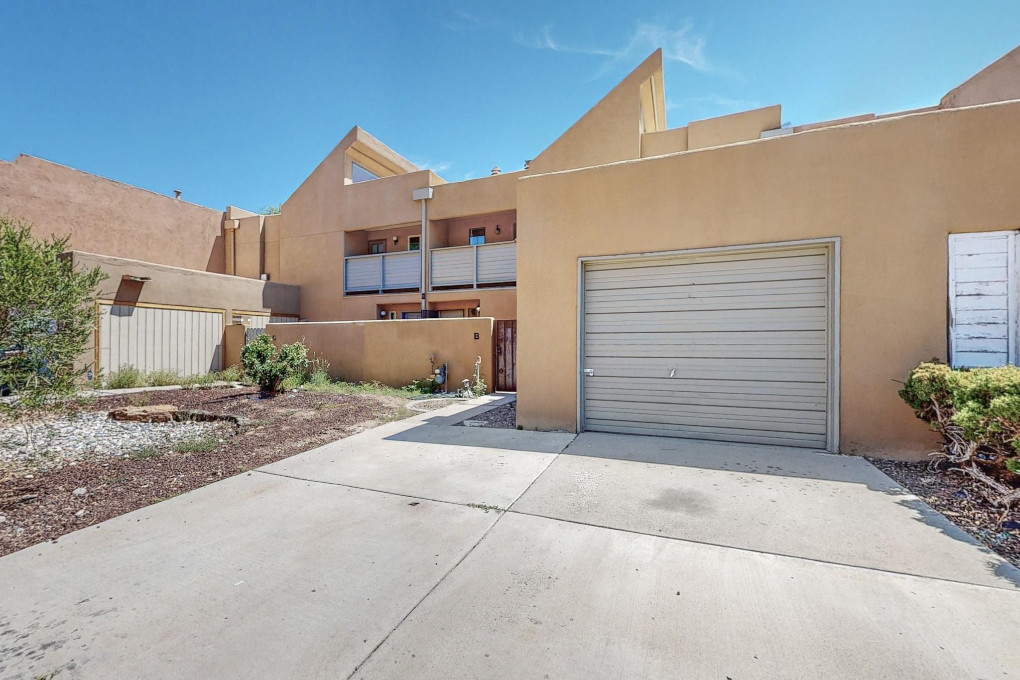 NEW FLOORING, NEW PAINT AND OTHER UPGRADES!Updated townhouse with three big bedrooms formal Dinning-room and a good size living room and architectural touches that creates dramatic interior spaces. Perfect Home for those who want to be near UNM, downtown and hospitals, balconies on both front and back of the property . Mountain views from upper level bedrooms Easy care courtyards front and back. dead-end Street provides this community with privacy and low traffic