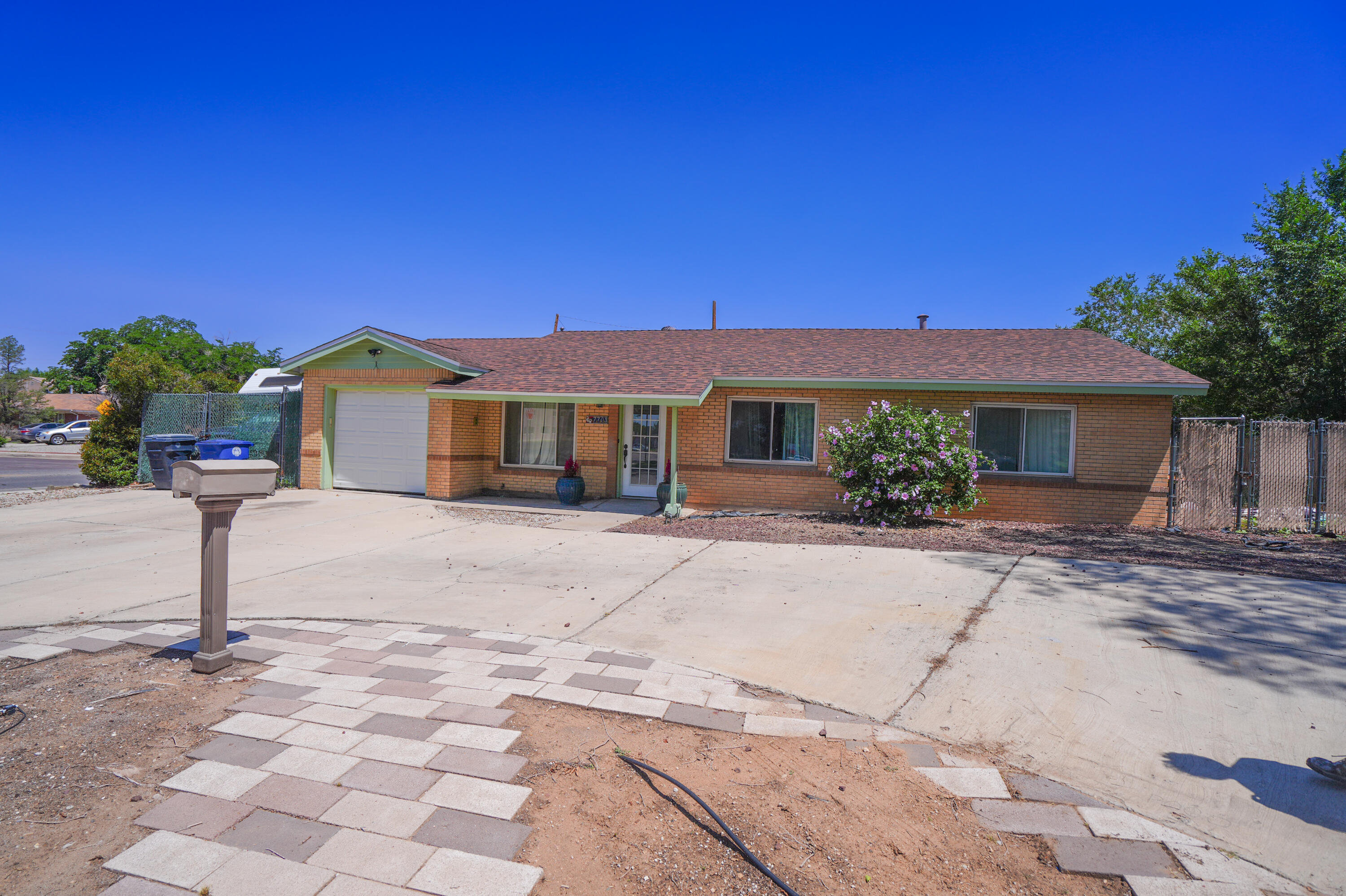 Discover this unique gem of a home located just across from a beautiful city park & within walking distance to Uptown Mall, Winrock Center, Coronado Mall, ChuzeFitness, theater, Trader Joe's, & diverse selections of excellent restaurants. This home boasts a great floor plan with plenty of space for gatherings and group activities. Highlights include an inground pool, newer roof, updated windows, two living areas, & a roomy kitchen equipped w/ newer appliances. The large eat-in kitchen and formal dining room are perfect for entertaining. The primary bedroom includes a private door to the pool area and has an attached office or personal space. Additional amenities include wood-burning fireplace, RV parking, & covered porch. Don't miss out on this amazing location & schedule a showing today!