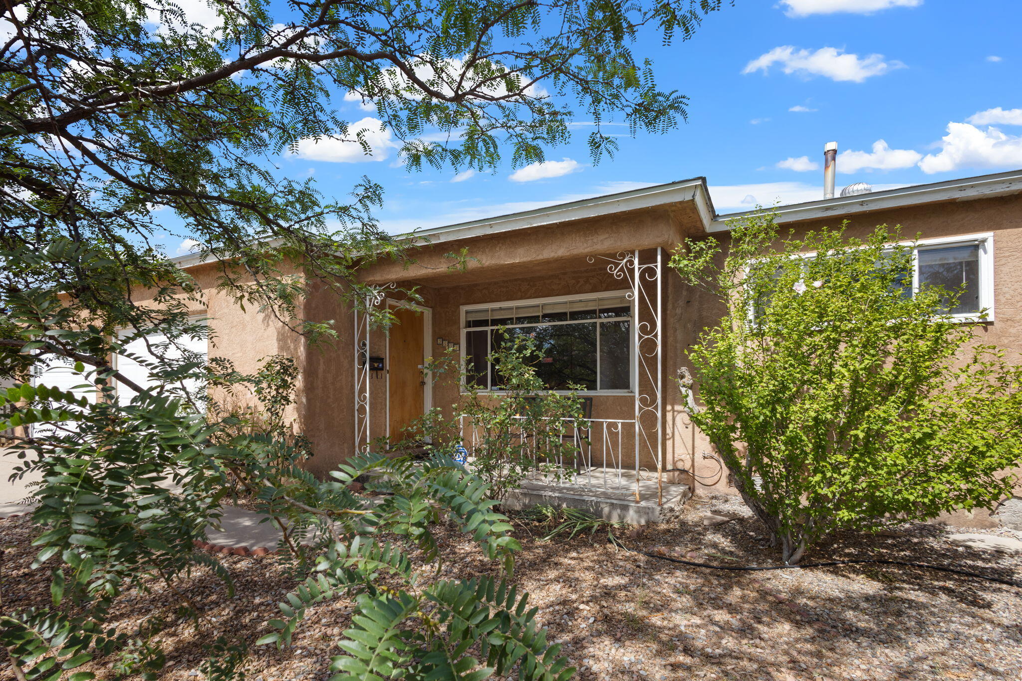 Welcome to 3501 Inca St NE in the Mesa Arriba neighborhood in Albuquerque's Northeast Heights. This 3 bedroom, 2 bath home boasts original 1 inch hardwood floors throughout majority of the home, a wood burning fireplace in the wood paneled back den with access to the backyard, a 2 car garage, and mature trees & rose bushes. New evaporative cooler in 2022.With 1652 square feet and lots of natural light, you will enjoy the flow between the 2 living rooms and dining room. A Roberson classic!Near great local shopping centers and schools, you'll enjoy convenience and the peace of an established neighborhood. Come see it today!