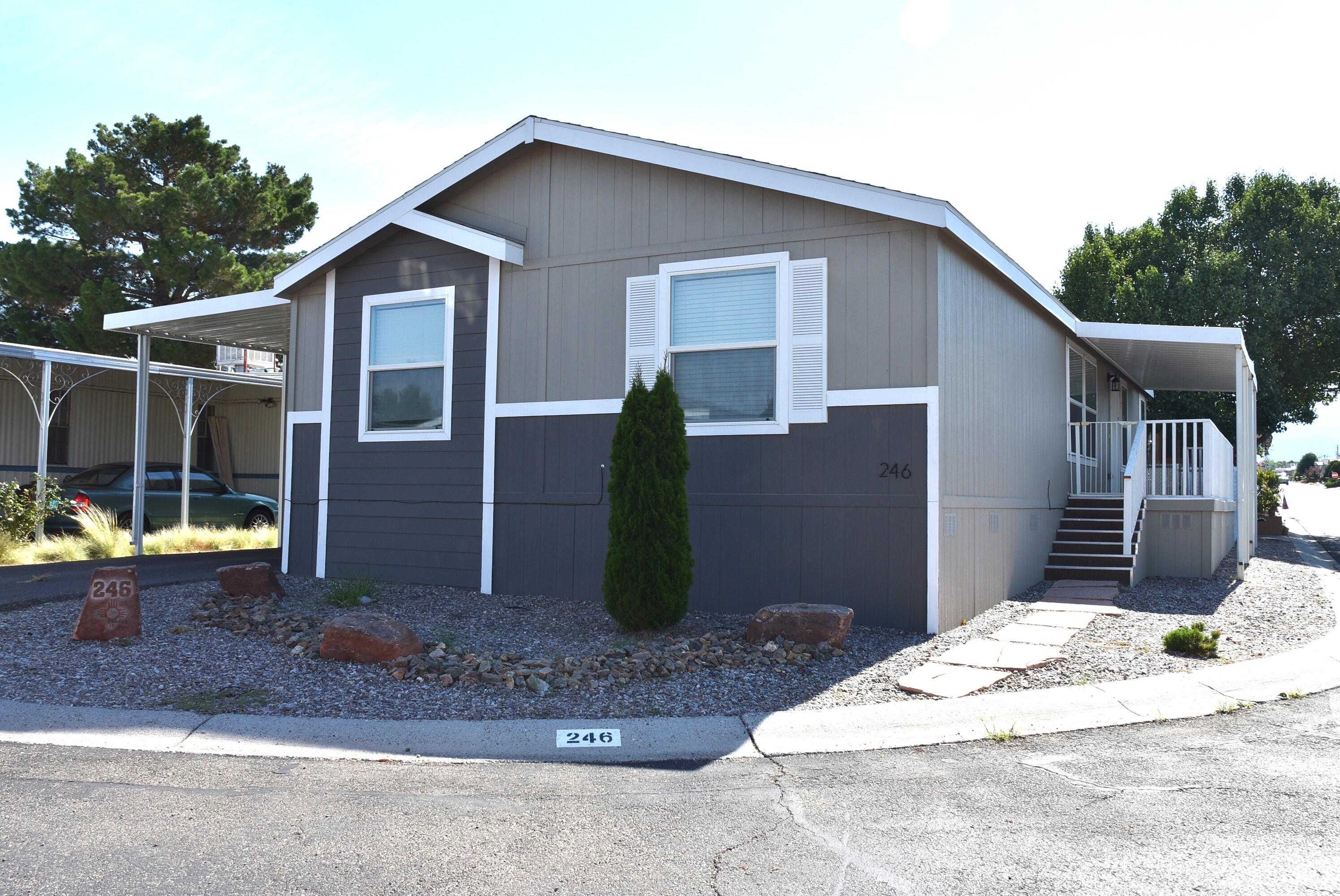 Beautiful almost new 2021 Cavco Double Wide, 3 bedroom 2 bath. Nice corner lot in the Albuquerque Meadows resort like 55+ age restricted gated community. Stainless appliances in kitchen also Amana washer and dryer included. Kitchen has large sit at pass across bar to the Livingroom. Lots of storage space. Master bath has double sinks and 60'' walk in shower. Guest bath has combination tub shower. Beautiful large front deck with no maintenance grass in side and back yard area. Fenced for pets. Double car carport and yes refrigerated air conditioning. Call for your private showing today.