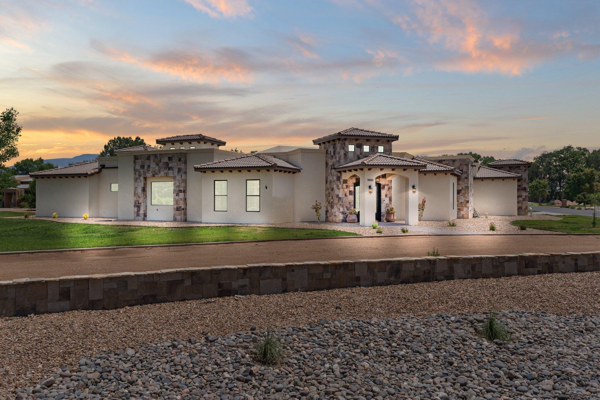 Luxurious Mediterranean style home by Rio Grande Construction, located behind the gates in the Bona Terra Farms community on a 1.16 acre property.  This expansive home boasts 4,930sf with 5 bedrooms, 5.5 bathrooms, a home theater and 6 car garage with backyard access. Beautiful living area with hand carved trusses lining the ceiling, fireplace and built-in wet bar. Chefs kitchen with designer cabs, quartz countertops, upgraded appliances, double islands, pantry and dining space. Pour a glass of your favorite wine from the temperature controlled wine wall or a drink from the built-in bar with taps! Catch the latest movie in your home theater. Owners suite w/ spa bath! Great outdoor space with built-in kitchen, pool/hot tub, fire pit & a huge covered patio w/ tongue & groove ceiling