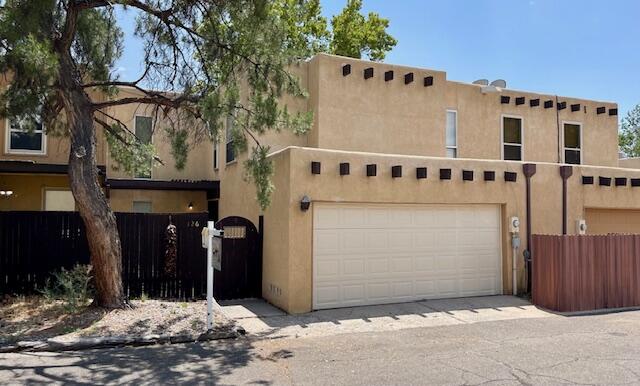 Step into this well-cared-for updated 3 bedroom, 3 bath townhome, ideally located on the north side of the Arroyo Del Oso golf course, near Academy. The home features 3 large bedrooms, with the master boasting a spacious walk-in closet and a deck with a view. The living room is a bright and airy space,  high vaulted ceilings and an abundance of natural light. A cozy fireplace adds to the charm. The property offers enclosed front and back yards, perfect for outdoor gatherings. There's also a 2 car garage, a community pool, and a clubhouse. A stackable washer and dryer were installed last year for added convenience. With modern amenities such as Sprouts, Whole Foods, the golf course, and many restaurants just a short distance, this home offers the perfect blend of comfort and convenience.