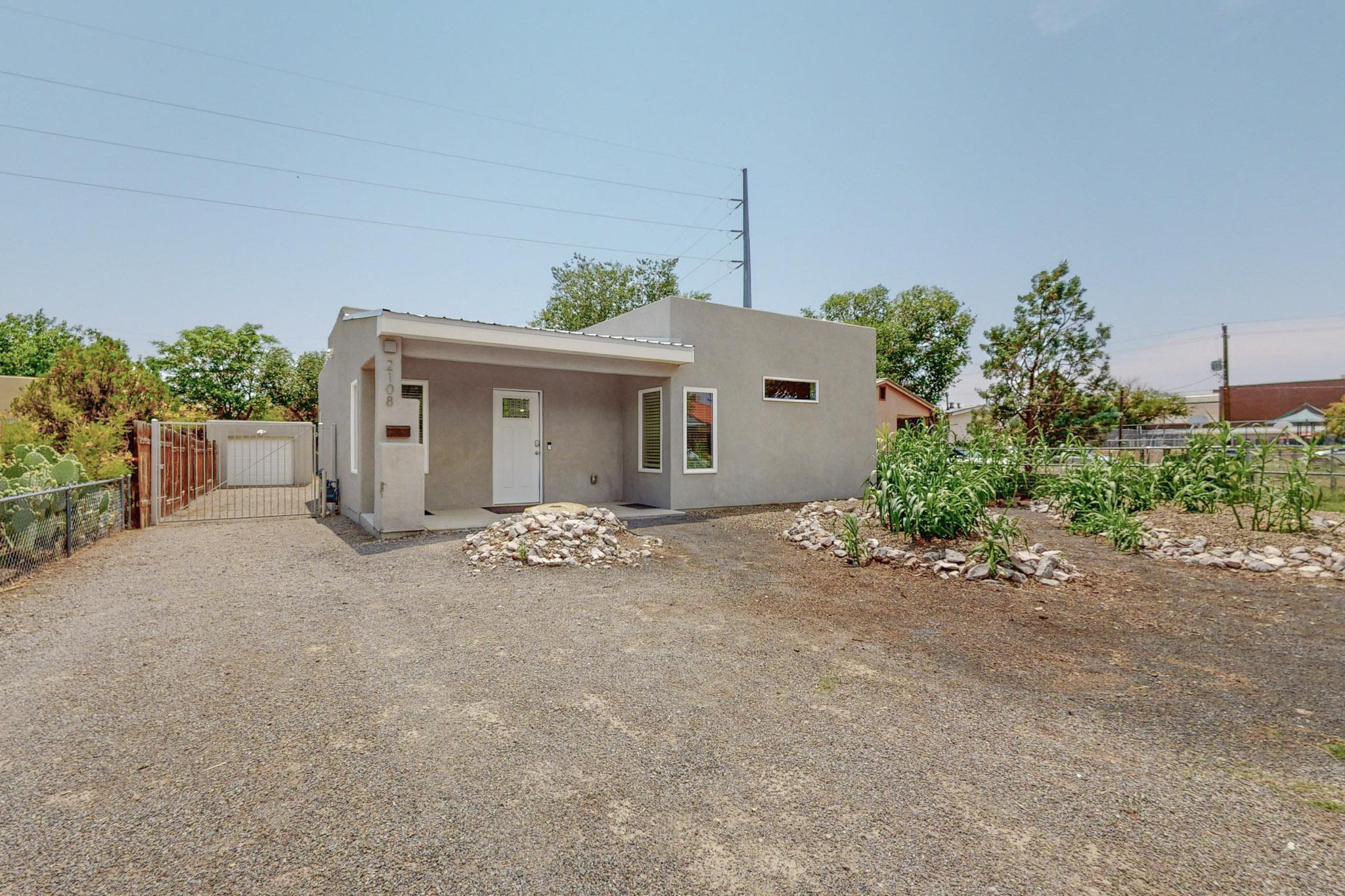 Great location! Charming Updated Home with Versatile Workshop. This beautifully updated residence seamlessly blends modern comforts with versatile spaces for every need. Located in UNM South area. Features included: refrigerated air, backyard access, ally access, workshop (with endless possibilities!), newer roof, small cellar and all appliances convey! The open concept living and dining areas are perfect for entertaining or relaxing. Newer windows fill the rooms with natural light, creating a warm and inviting atmosphere. Move in ready and easy to show.