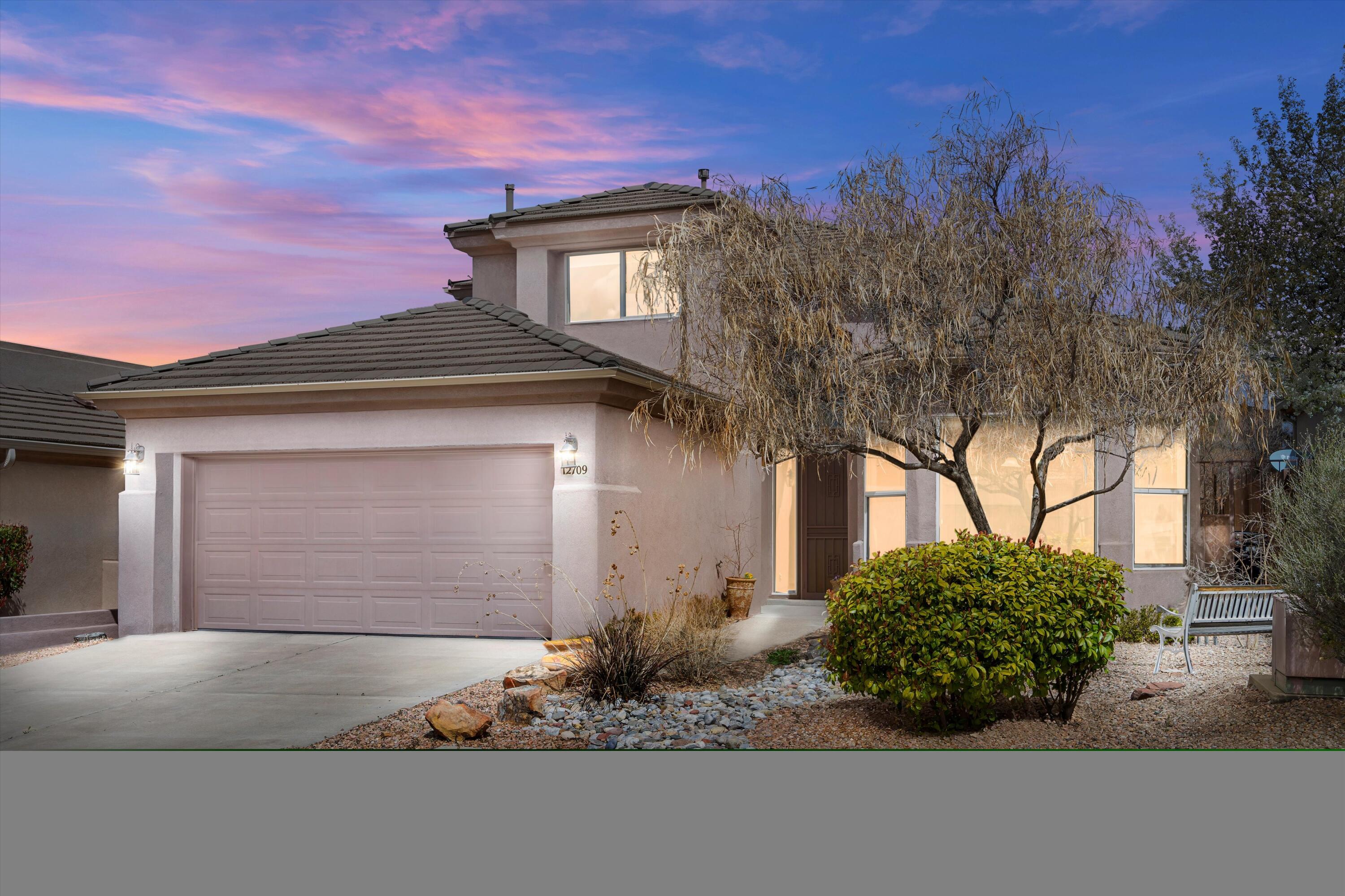 Experience High Desert living in this elegant home in a gated community. This 3-bed/3-bath house spans 2 stories and includes a 2-car garage. Located on a quiet cul-de-sac, it boasts Southwest-style landscaping for great curb appeal. The interior has a spacious layout with grand entryway, high ceilings, and arched doorways. Tile floors cover the entry, kitchen, dining, and great room, which has a cozy fireplace. The kitchen is outfitted with granite countertops, built-in ovens, a cooktop, custom cabinets, and a prep island with bar seating. A curved staircase leads to a loft with views of the Sandia Mountains. The master suite on the main floor includes a jetted tub and large walk-in closet. Atrium doors open to a beautifully landscaped backyard with covered and open patios. Call ASAP!