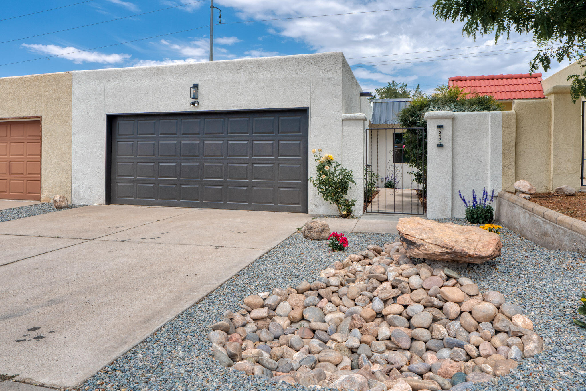 Welcome to this newly renovated 3-bedroom, 2-bathroom home in the NE Heights! Featuring a beautifully landscaped front yard with drip irrigation and a spacious 2-car garage, this residence blends style and practicality. Inside, stunning light fixtures illuminate an open, airy layout. The modern kitchen boasts elegant granite countertops and sleek stainless steel appliances, ideal for everyday living and entertaining. Practical upgrades include a new roof, evaporative cooler, water heater, and updated plumbing fixtures, ensuring long-term comfort. Each room is designed with high-quality finishes, merging comfort with sophistication. Enjoy the convenience of no homeowners association and proximity to shopping and dining. This move-in-ready gem is waiting for you--don't miss out!