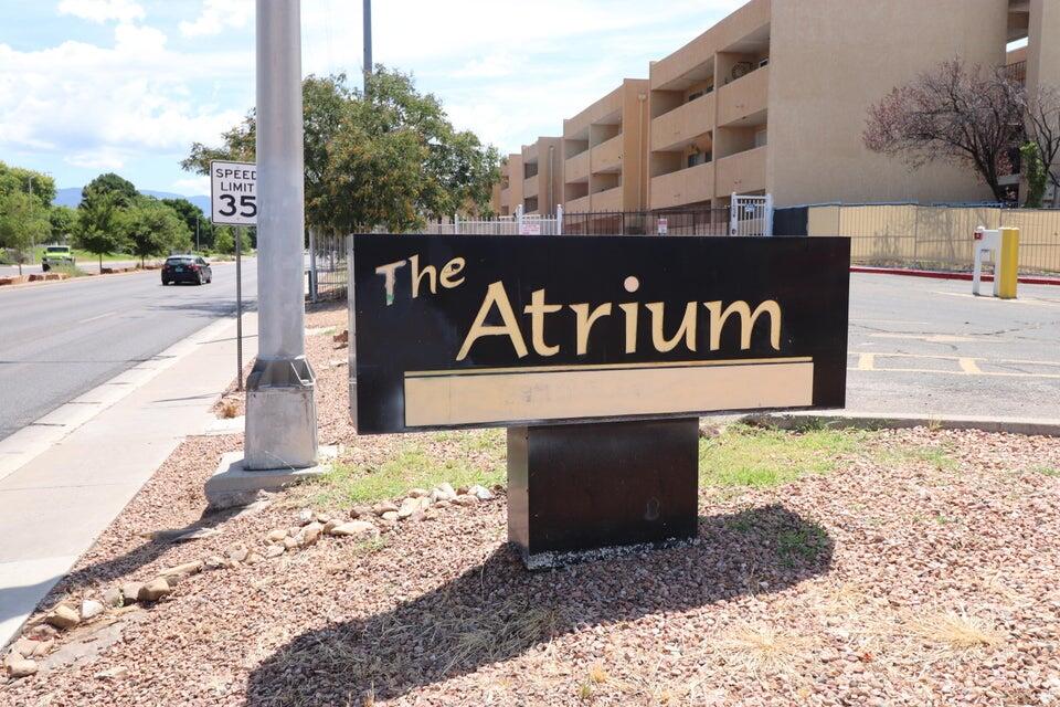 Welcome to The Atrium, a private & affordable gated community  This cozy 1st floor, 2 BR, 840 SF condo, boasts a private patio & a welcoming central community courtyard. The HOA monthly fee covers water, gas (heating), taxes,& insurance for the entire building. As a homeowner, you'll only need to pay for your electric usage.  Enjoy a range of fantastic community amenities, including a clubhouse, outdoor pool, patio area with grills & a firepit, a gym area with bathrooms and a dry sauna and pet relief area. The unit comes equipped with a mini combo washer/dryer and on-site laundry facility for added convenience. Nearby restaurants & shopping, make The Atrium a perfect place to call home.