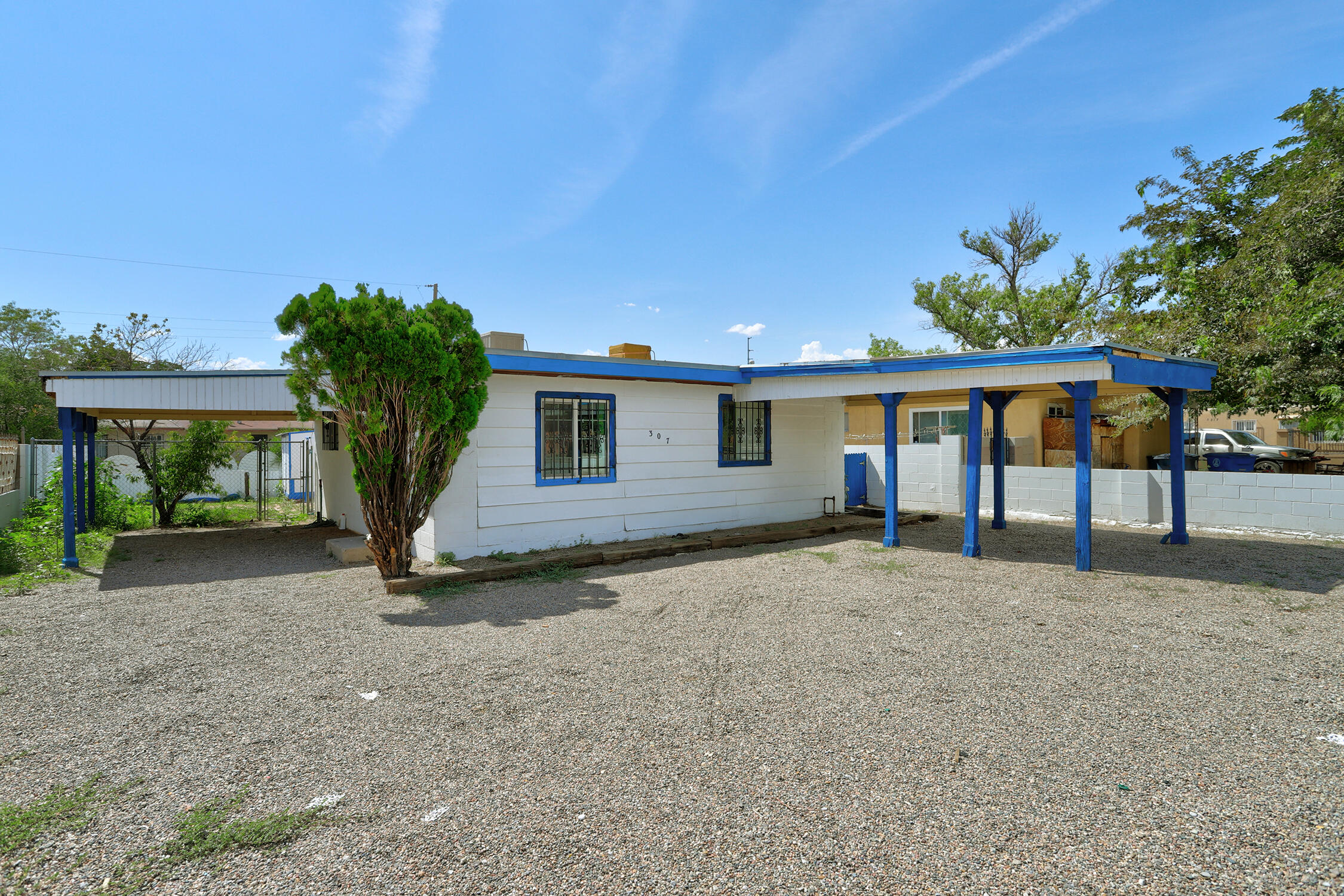 New roof installed 9/11/2024 Duplex converted to single family. Could be converted back for income property. As a single-family home this property offers a large eat in kitchen living room and two bedrooms with their own 3/4 baths. Covered parking. Large lot! Two storage units in backyard.