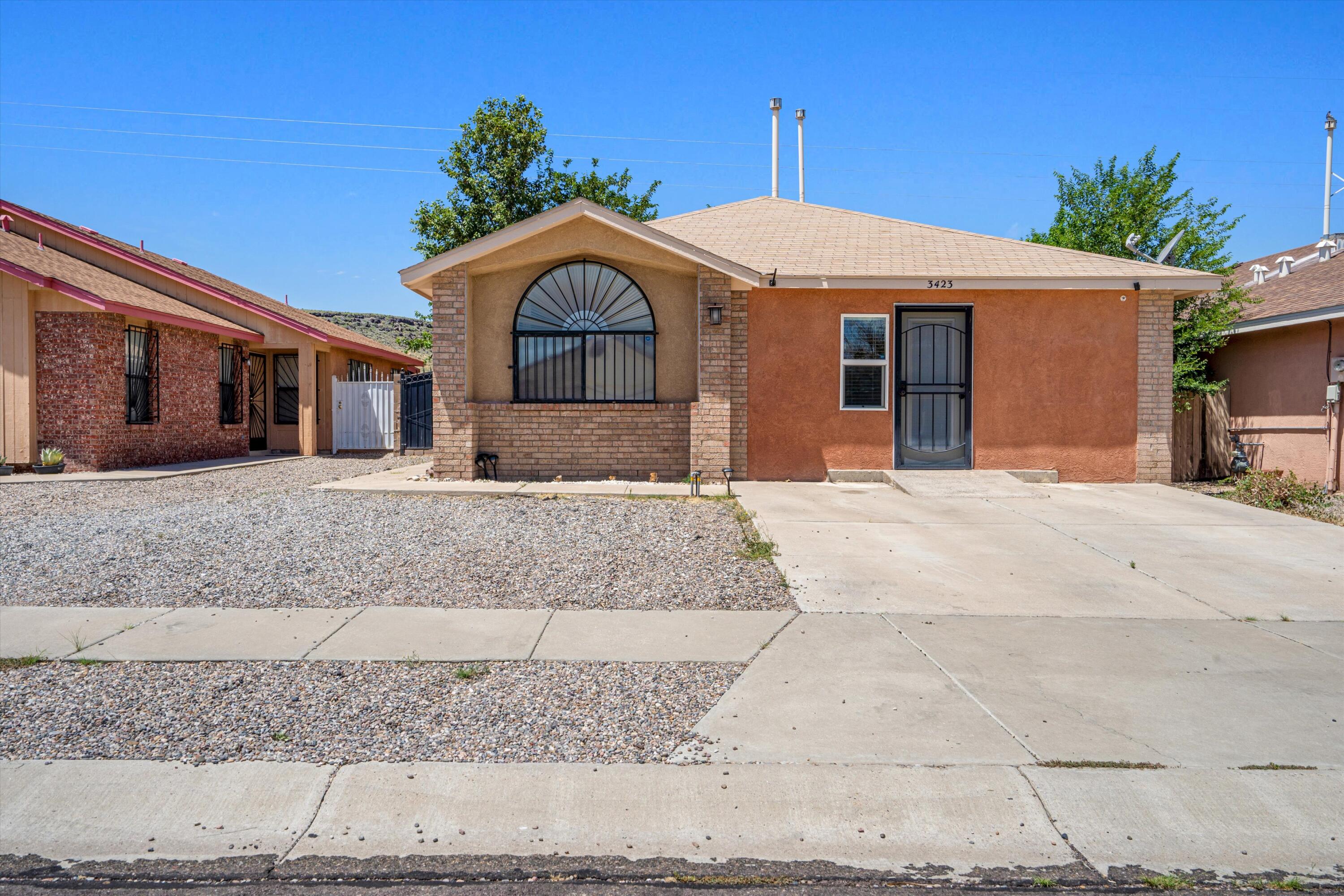 This beautifully updated residence boasts a welcoming open floor plan and stylish tile flooring throughout. The country kitchen is a chef's delight, featuring elegant granite countertops, a chic backsplash, and a built-in china cabinet. Both bathrooms have been thoughtfully remodeled withnew flooring and sleek granite counters.Enjoy the spacious feel of vaulted ceilings and the comfort of laminate flooring in the master bedroom. The additional bedroom offers a built-in cabinet for extra closet space, enhancing convenience. The garage has been transformed into a versatile bedroom.T he park-like backyard is perfect for entertaining.