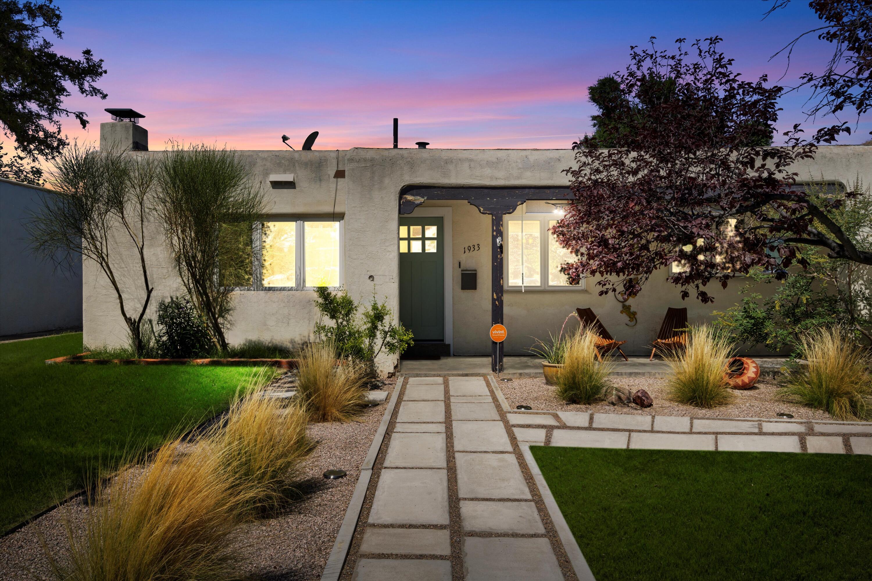 This charming, well-maintained adobe style home has potential for an open floor concept and expansion in its HUGE backyard. Built in 1948 in the Sandia Ridge Park Neighborhood, close to Nob Hill; this property has a blend of traditional and contemporary enhancements. The 1,123 sq. ft. home includes 3 bedrooms, 1 bath (remodeled featuring a spa walk in shower with dual Delta rain head and hand shower), stainless steel appliances including 6 burner gas range, coved ceilings with crown molding in the living room and a wood burning fireplace, and 1 car attached garage with remote access. Upgrades include refinished original hardwood floors, large-custom sized, low-e, vinyl casement windows with wood sills, new wood front door, surveillance system with smart panel, new water and sewer mains to