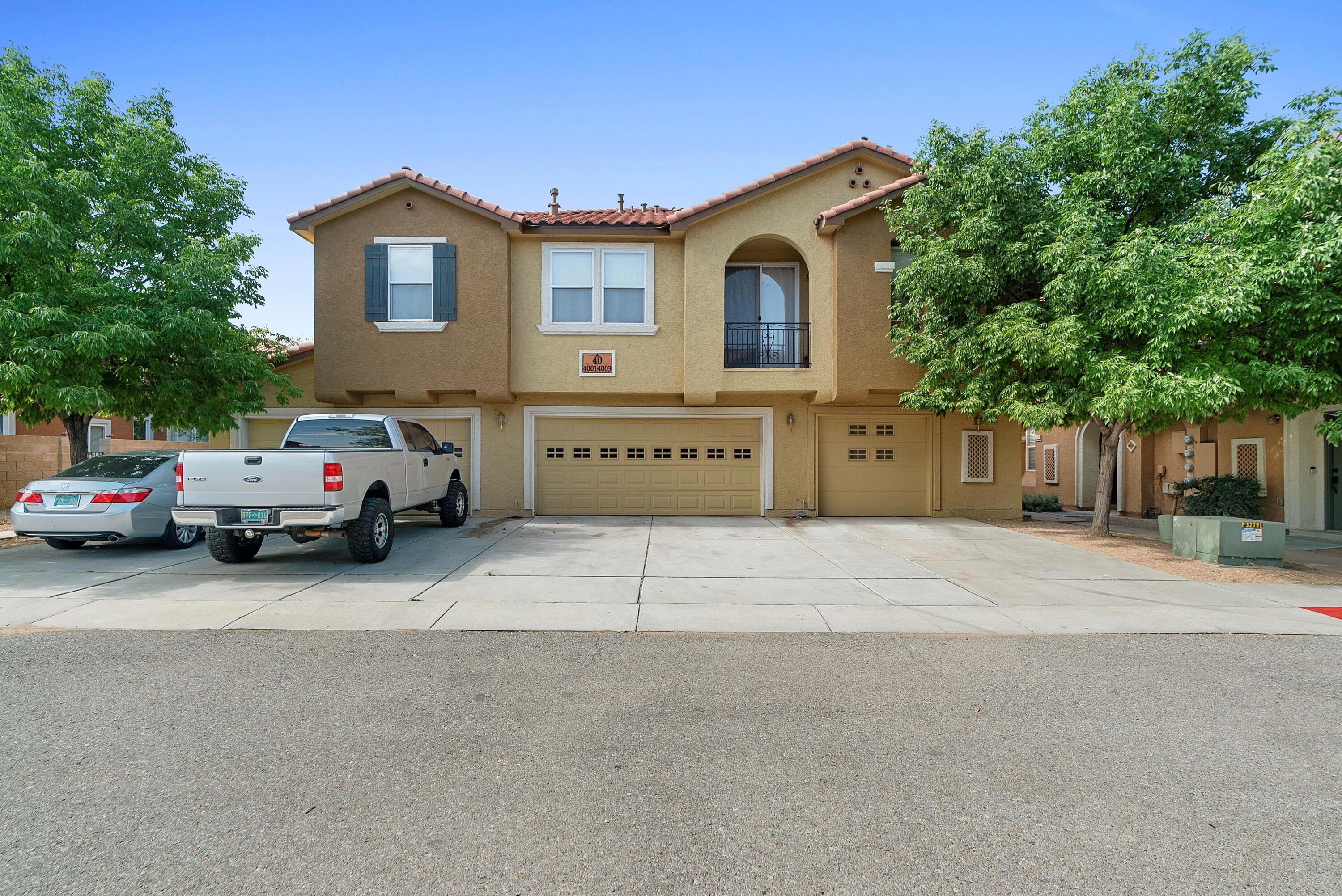 Welcome to this 4-bedroom, 3-bath condo in a secure gated community with a community  pool, perfectly situated near UNM, Uptown, and Downtown. The main floor offers a bedroom and full bath, along with a great room and a spacious dining area that opens to the backyard patio. The kitchen is well-appointed with 42'' cabinets, a pantry, Silestone countertops, and stainless steel appliances. Upstairs, you'll find two guest rooms, a full bath, and a generous primary suite featuring a large walk-in closet and a relaxing garden tub. All appliances are included!