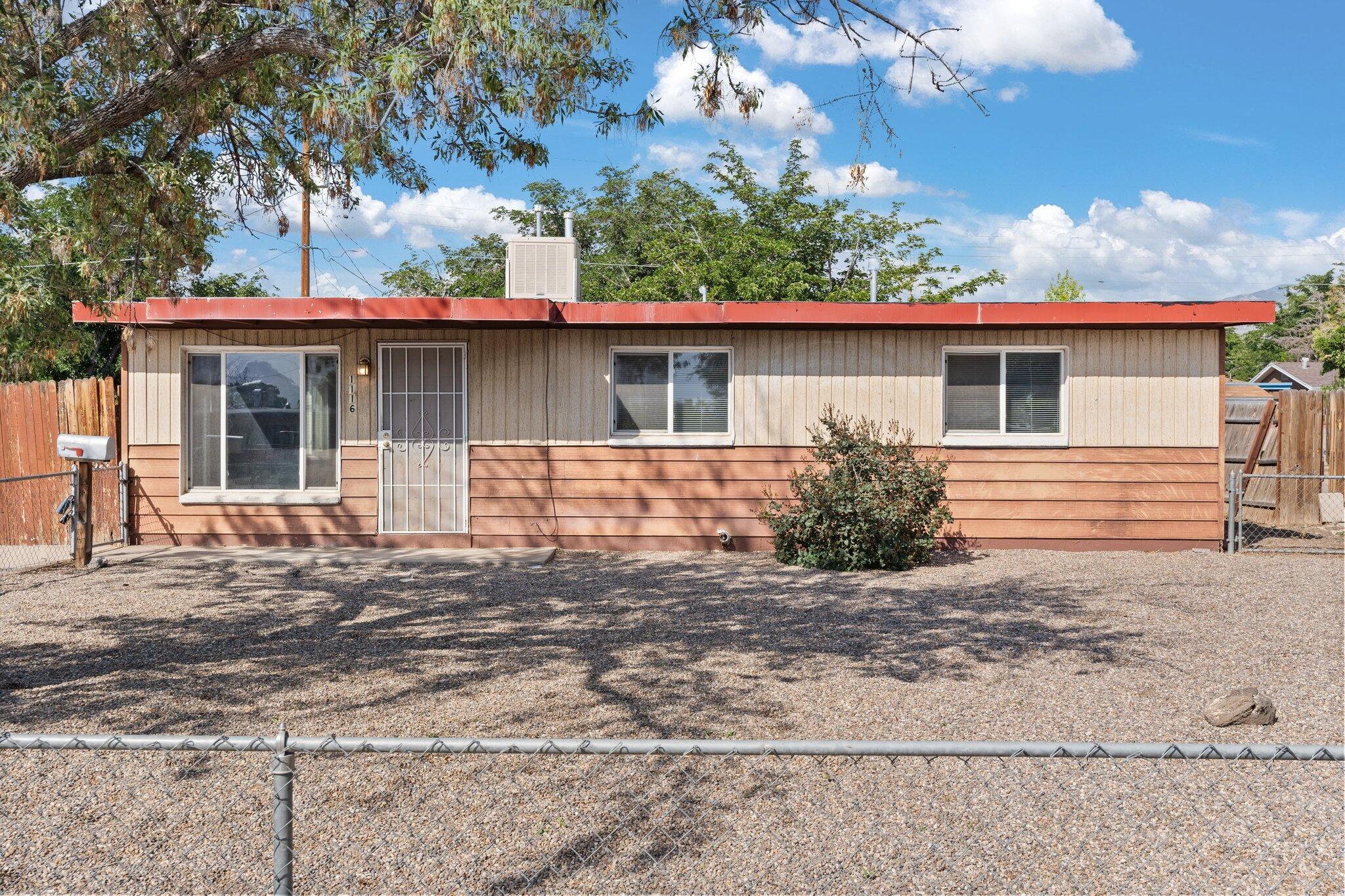 This charming three-bedroom, one-bath home is perfect for comfortable living. Featuring a spacious layout, exposed tongue and groove ceiling the property offers plenty of natural light and versatility for any lifestyle. New roof replaced in 2024 with a transferable warranty. Easy access to freeway, Kirkland Air Force, and Sandia Labs. Book your showing today!