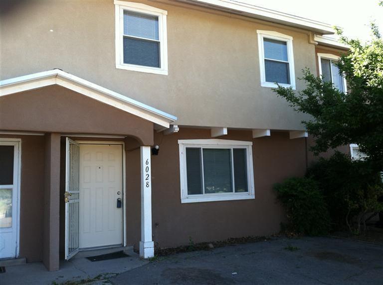 Welcome to 6028 Calle Diez NW, a beautifully crafted 3-bedroom, 2-bath townhouse in Albuquerque's sought-after North Valley. Enjoy stunning views of Grecian Park and easy access to the Bosque's walking and biking trails for outdoor adventures. The private backyard, with a flourishing vegetable garden, offers a peaceful retreat and sustainable living space. Ideal for single professionals, new families, or investors, this home blends rural charm with modern convenience. Close to shopping, dining, and unique North Valley amenities, it promises a laid-back, community-focused lifestyle in a vibrant setting. If  you're handy this property might be just what you're looking for! With a little bit of work you can fall into EQUITY!!!