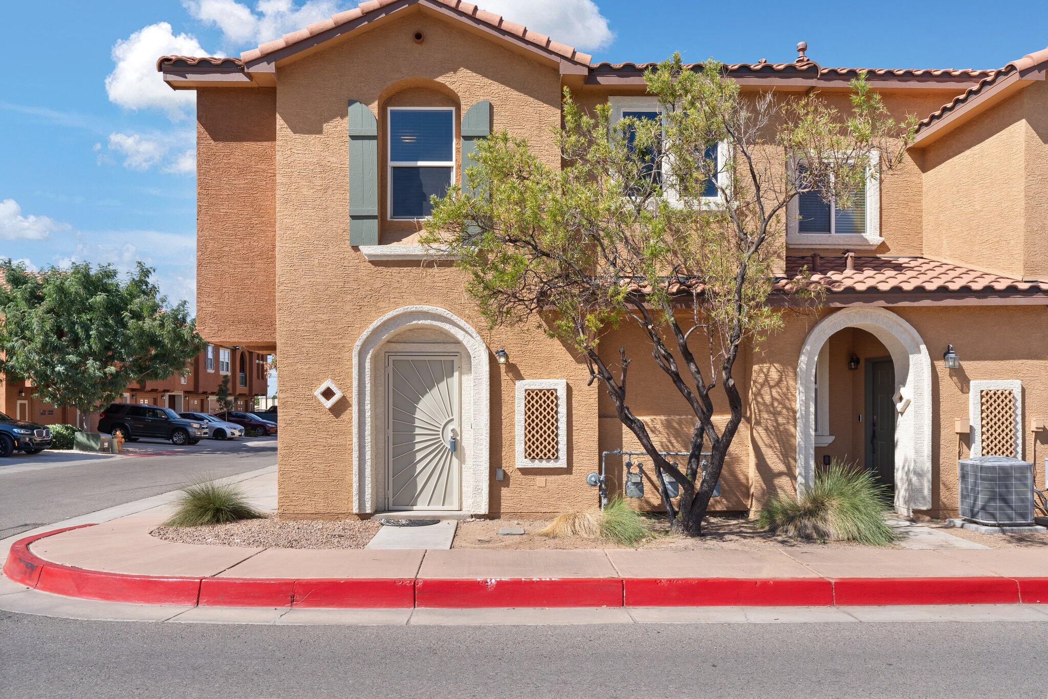 Gorgeous KB condo located in the exclusive and gated Menaul Villas community of the North Valley. Ground level entry and garage. Spacious living area with upgraded laminate wood look floors! Kitchen with ample cabinet space, solid countertops, gas range, microwave, refrigerator, breakfast bar and a pantry. Enjoy evenings on the balcony. Great owners suite with a walk-in closet and private bath. Bath hosts a large soaker tub! Washer and dryer included!  Community amenities include a pool, clubhouse, and HOA-covered water and trash services.