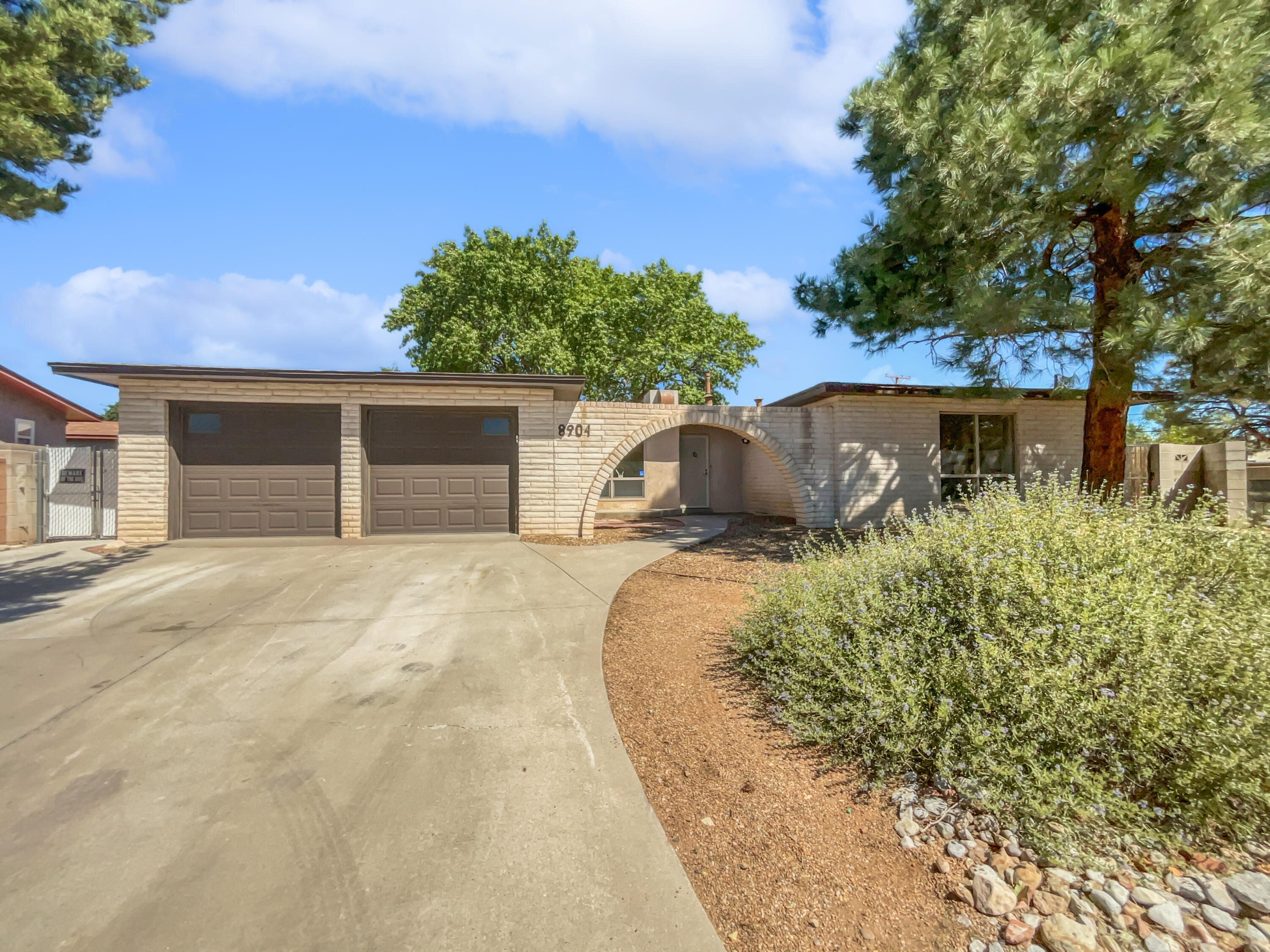 Welcome to this charming home that is sure to impress. The living room features a cozy fireplace and fresh interior paint in a neutral color scheme, creating a warm and inviting atmosphere. The kitchen comes with sleek stainless steel appliances. The primary bedroom is a true retreat, offering a walk-in closet and double closets for ample storage. The primary bathroom includes double sinks for convenience. Enjoy outdoor gatherings on the covered patio in the fenced backyard, and make use of the extra storage shed. The home also features partial flooring replacement. Don't miss out on this unique property with its blend of comfort and style.