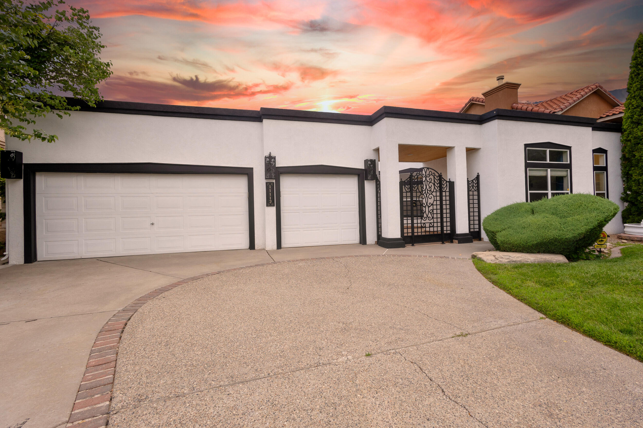 Stunning Single-Level Home Overlooking Tanoan Golf Course! This exquisite one-level home offers a prime location backing the signature hole of the Tanoan Golf Course. With breathtaking views and thoughtful updates throughout, this residence is a rare find. The home features a spacious layout with 3 large bedrooms, 2 full baths, and an expansive 3-car garage. Enjoy modern comforts with refrigerated air, gleaming hardwood floors, and soaring high ceilings. The gourmet kitchen is a chef's dream with custom cabinetry, granite countertops, and ample skylights that fill the space with natural light. Some luxurious amenities include updated bathrooms, a retractable awning for the extended covered patio, and a sparkling pool perfect for summer relaxation.