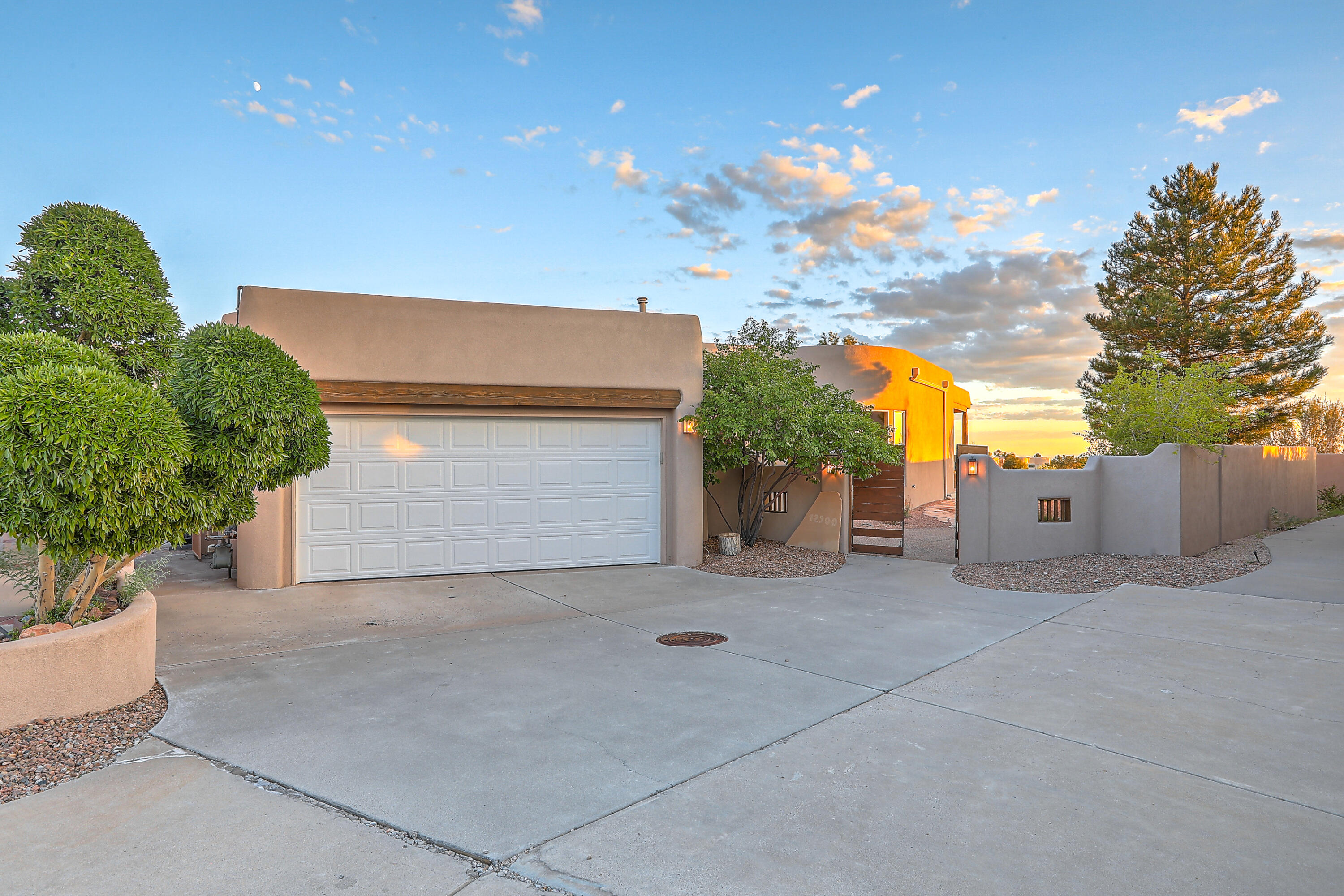 Discover the elegance of this single-level Scott Patrick home, nestled in the prestigious High Desert master-planned community. This 3-bedroom gem seamlessly blends modern luxuries with classic Southwest charm. The kitchen and baths have been thoughtfully updated with tile flooring throughout the home. A stunning wall of windows in the living area invites you to take in breathtaking city views, complemented by automated blinds for convenience. Enjoy mountain views from the dining area as well. The wrap around courtyard has recently been refreshed with new flowers and plants, and there's a lovely solarium--perfect for hobbies or plant enthusiasts. Plus, the home boasts a recently added tankless WH and a brand-new refrigerator. All this on a large lot backing to open space