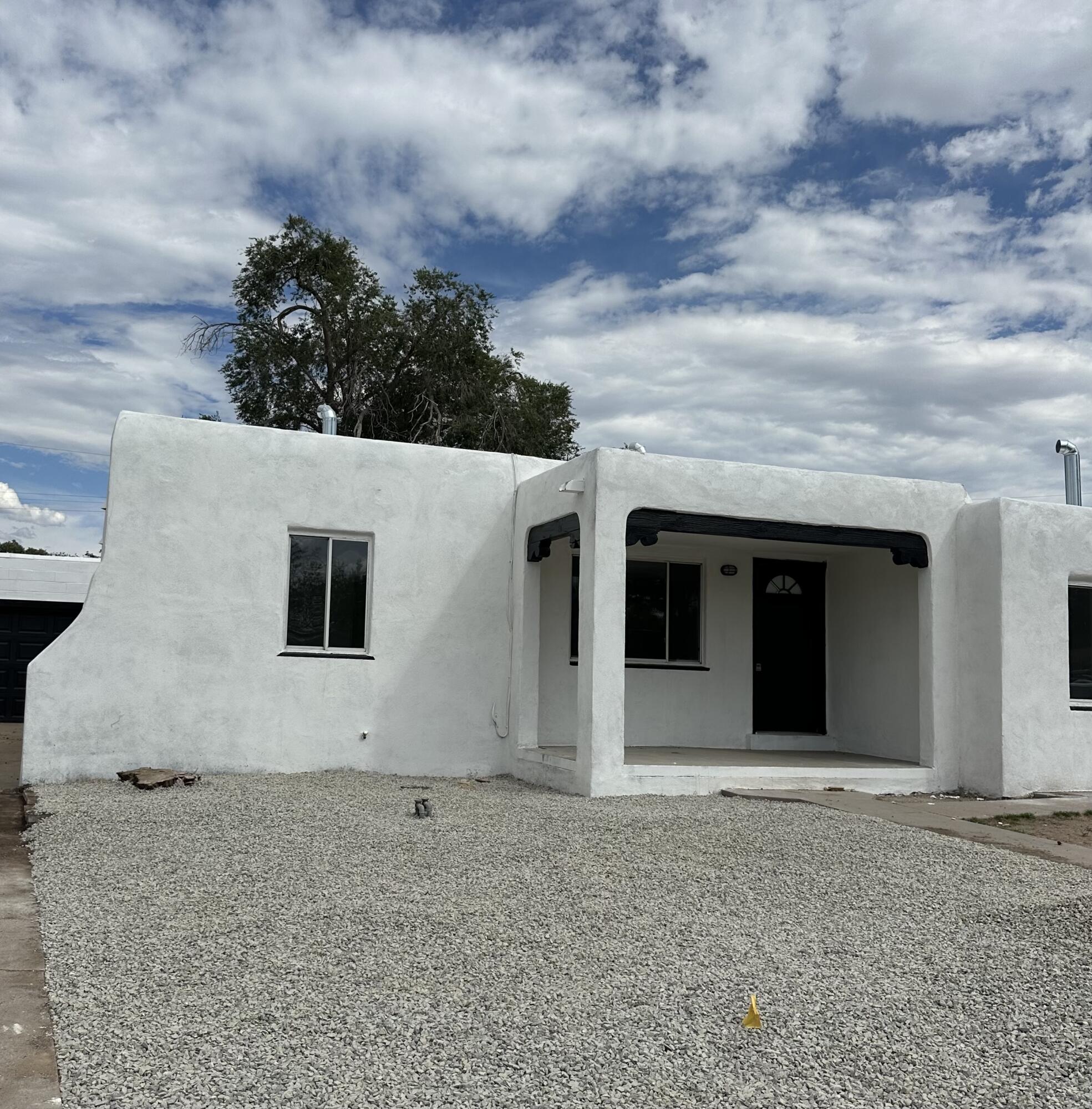 Renovated 3 bed 1 bath home near the University of New Mexico. Many updates include TPO Roof, Heat/Cool Combo, Vinyl plank flooring, tiled bathroom, kitchen cabinets with Quartz countertops and more! Spacious backyard with a 1 car garage.