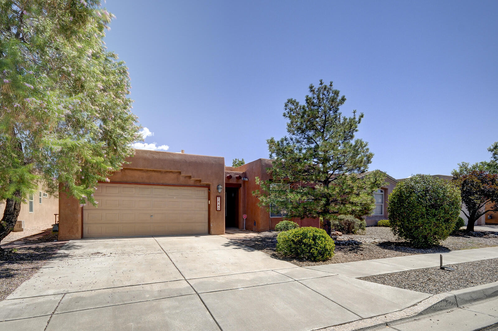 Welcome to this beautifully maintained Single-level, 4-bedroom home in the highly sought-after Vista del Norte Subdivision. This home has been meticulously cared for, featuring a TPO membrane roof installed in 2022 with transferable warranty, HVAC system in 2023, and fresh carpet installed in Summer 2024. The spacious interior includes a welcoming tiled foyer & an open-concept kitchen that flows seamlessly into the living room. The master suite is designed for comfort with a walk-in closet & a dual vanity sink. The kitchen is well-appointed with stainless steel appliances & granite countertops. Each bedroom is generously sized & equipped with a ceiling fan. Low-maintenance yard includes a covered patio, perfect for entertaining. Quick access to parks, Journal Center & Paseo Del Norte