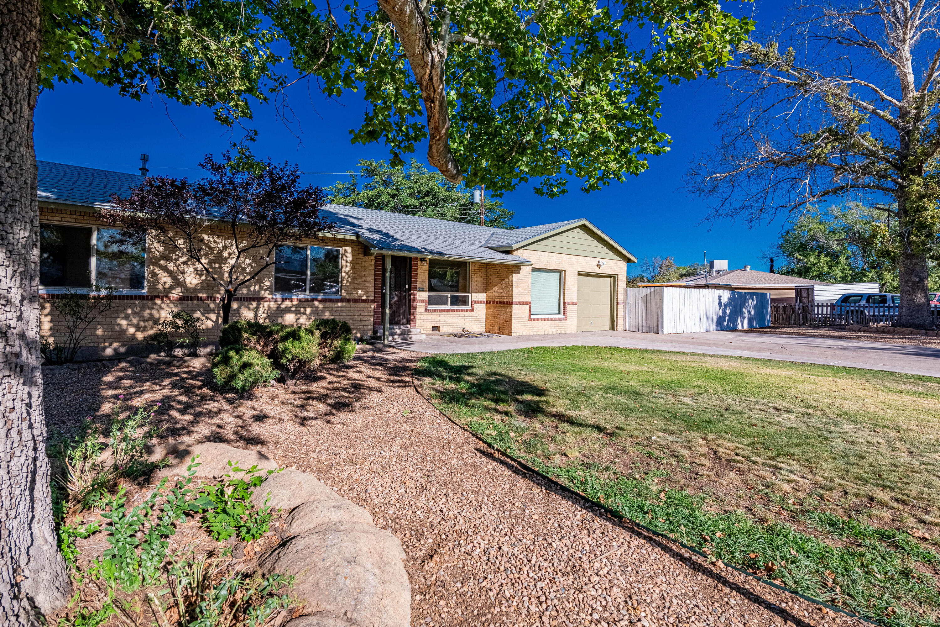 Welcome to this beautifully updated single-story home in sought after Hoffmantown near ABQ Uptown offering 4 spacious bedrooms and 3 full bathrooms. Enjoy the luxury of two en suite bedrooms, perfect for privacy and comfort. The home boasts refinished original oak flooring and stylish new recessed LED lighting with dimmers throughout, enhancing the contemporary feel. The kitchen has been thoughtfully upgraded with brand new granite countertops making it both functional and inviting.