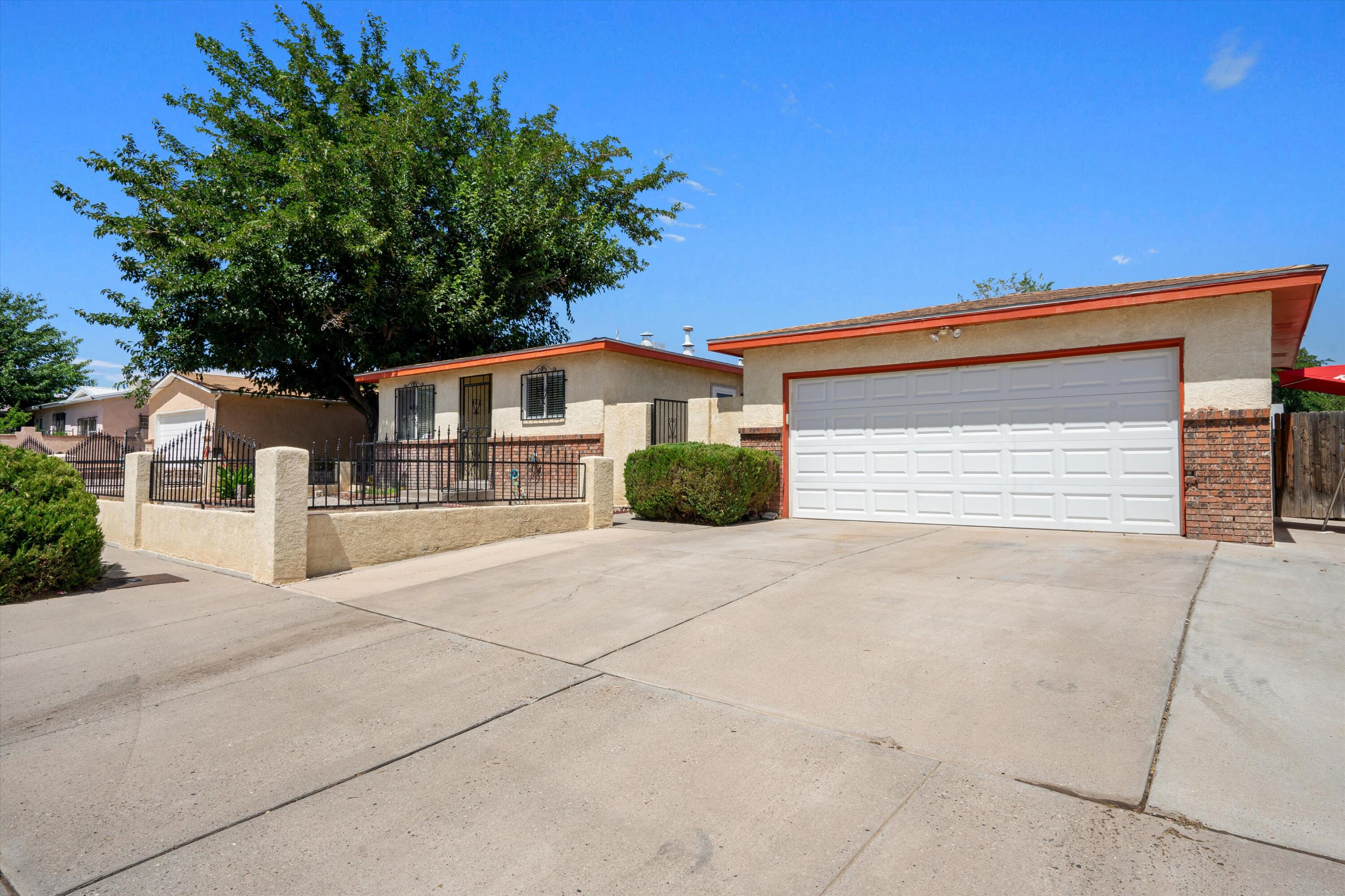 Welcome to this well-maintained 3-bedroom, 2-bathroom home, ideally located in the Southwest. Featuring a large grassy backyard, a spacious storage shed, and a gated front yard, this property offers both security and convenience. The detached 2-car garage provides ample parking, and its proximity to nearby shopping centers makes daily errands a breeze.