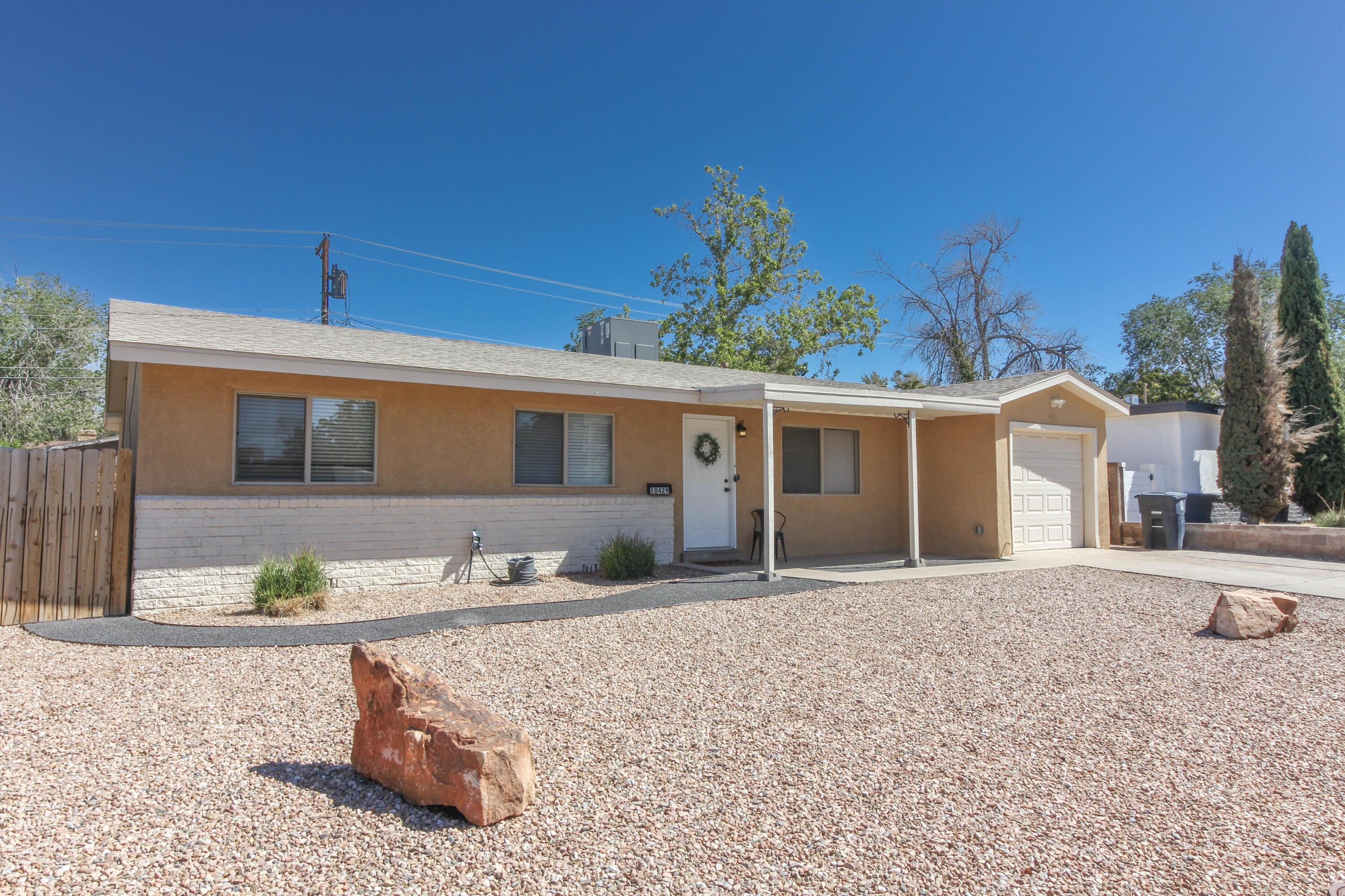 This is an amazing NE Heights find! Beautifully updated 3 bed 2 bath home with two living areas, a bonus room off of the primary bedroom, granite countertops, stainless steel appliances, refrigerated air, wood burning fireplace, smart home themostat, low maintenece xeriscaped front yard, and huge potential in the backyard with concrete patio and storage shed.  1 car attached garage.  Oversized laundry room with additional storage space.