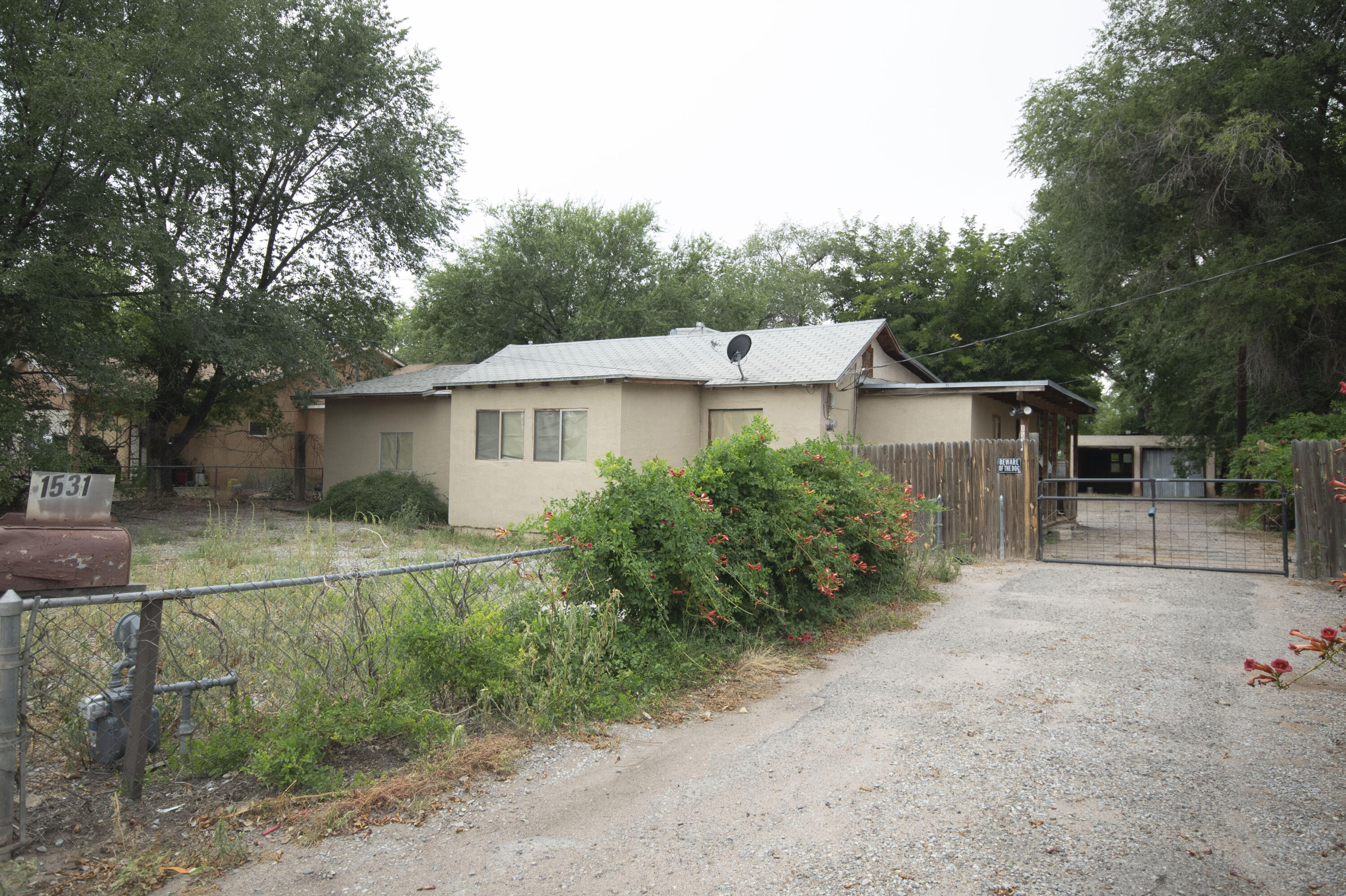 3 bed one and three quarter bath, right in the heart of the south valley, Narrow lot with plenty of room for horses to graze.  Irrigation rights to flood the fruit trees.  Home and garages will need some updating.