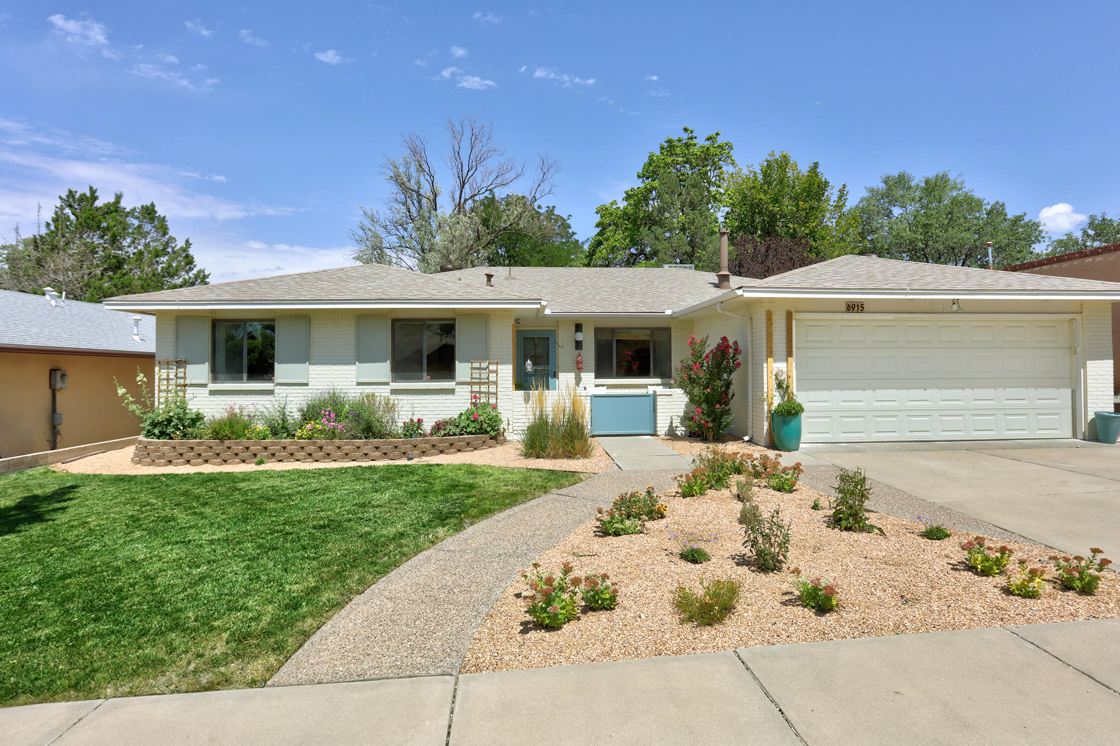 The bright and spacious Four-Bedroom home is ready for you. Located in one of Albuquerque's most sought-after neighborhoods. This home has modern designs and touches throughout, that you don't often find in Albuquerque.As you enter the home you'll step into a bright Living Room with a custom-built bookshelf. Just off the Living Room is the Family Room with ample space for gatherings or just relaxing. The kitchen has a perfect balance of space and function, offering plenty of counter space and a kitchen island (the coffee nook is even more bonus space!). The home's four bedrooms allows you to live comfortably as have an office to work from home. The large primary bedroom has a walk-in closet and an ensuite bathroom.