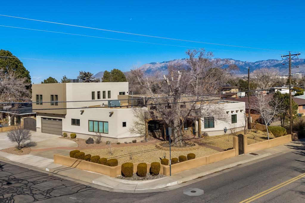 Fantastic custom home. Too many features to even list. Made to exacting owner standards with high end materials, fixtures and appliances. Super insulated and incredibly quiet. Private back yard with relaxing portal. Beautiful wood Vigas and latillas, high ceilings and even views of the Sandias. Perfect layout for a family with children or  extended families. Details that showcase attention to detail and thoughtful planning. Near the university and downtown hospitals, convenient and central, quiet and comfortable.