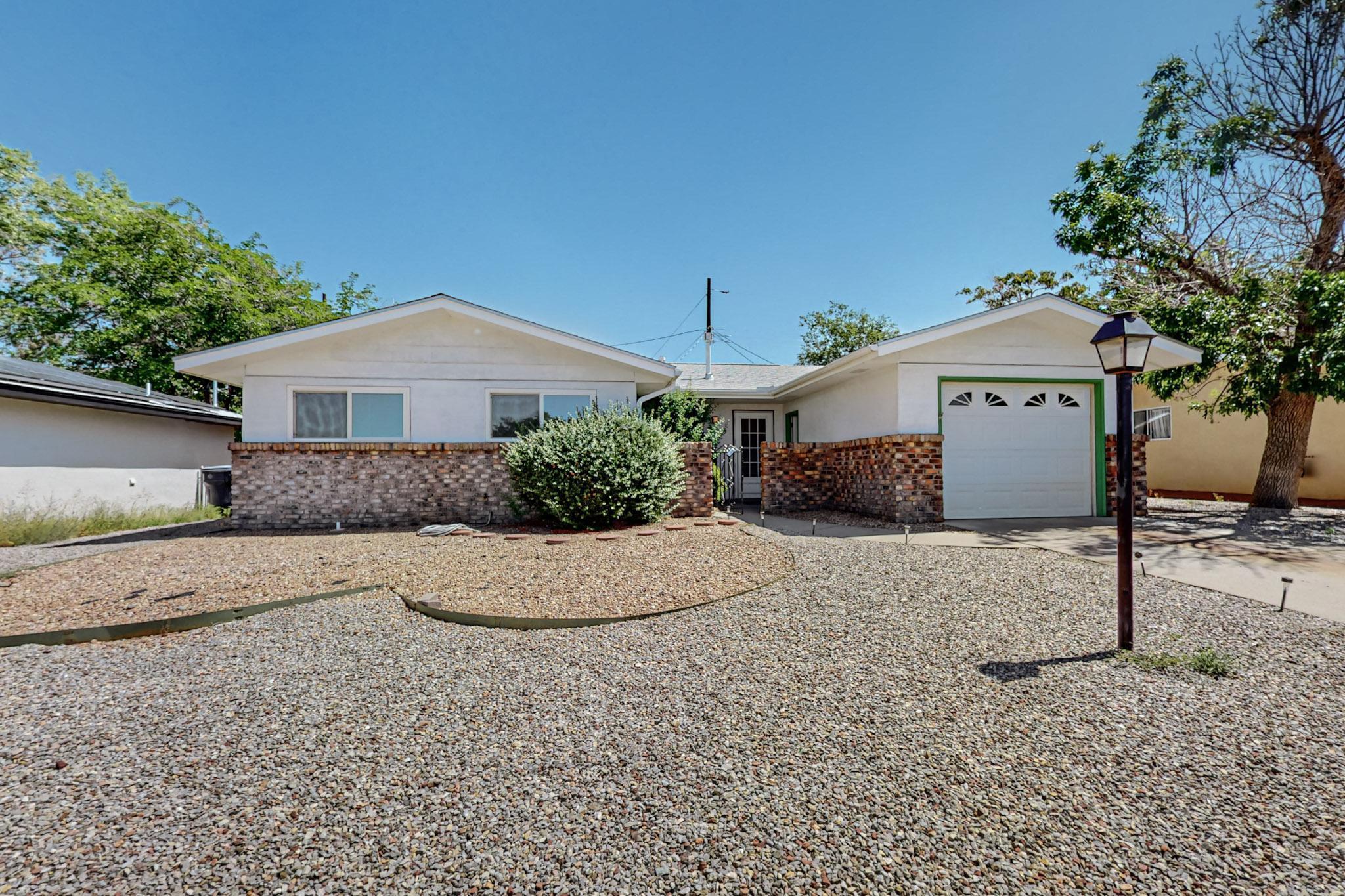 Check out this CHARMER!! One owner since 1970! Lovingly cared for with modern updates like REFRIGERATED AIR CONDITIONING! Roof was replaced in 2020 and has 1 year left on the warranty. windows were replaced in 2005! Some cool retro features still there. Home was FRESHLY PAINTED 9/24. COURTYARD ENTRY!Primary bedroom has walk in closet and .75 bath*separate laundry room with door to backyard. 2 living areas or living and formal dining and a kitchen nook*Home also features LARGE BACKYARD with block walls. covered porch. producing PEACH TREE*single car detached garage