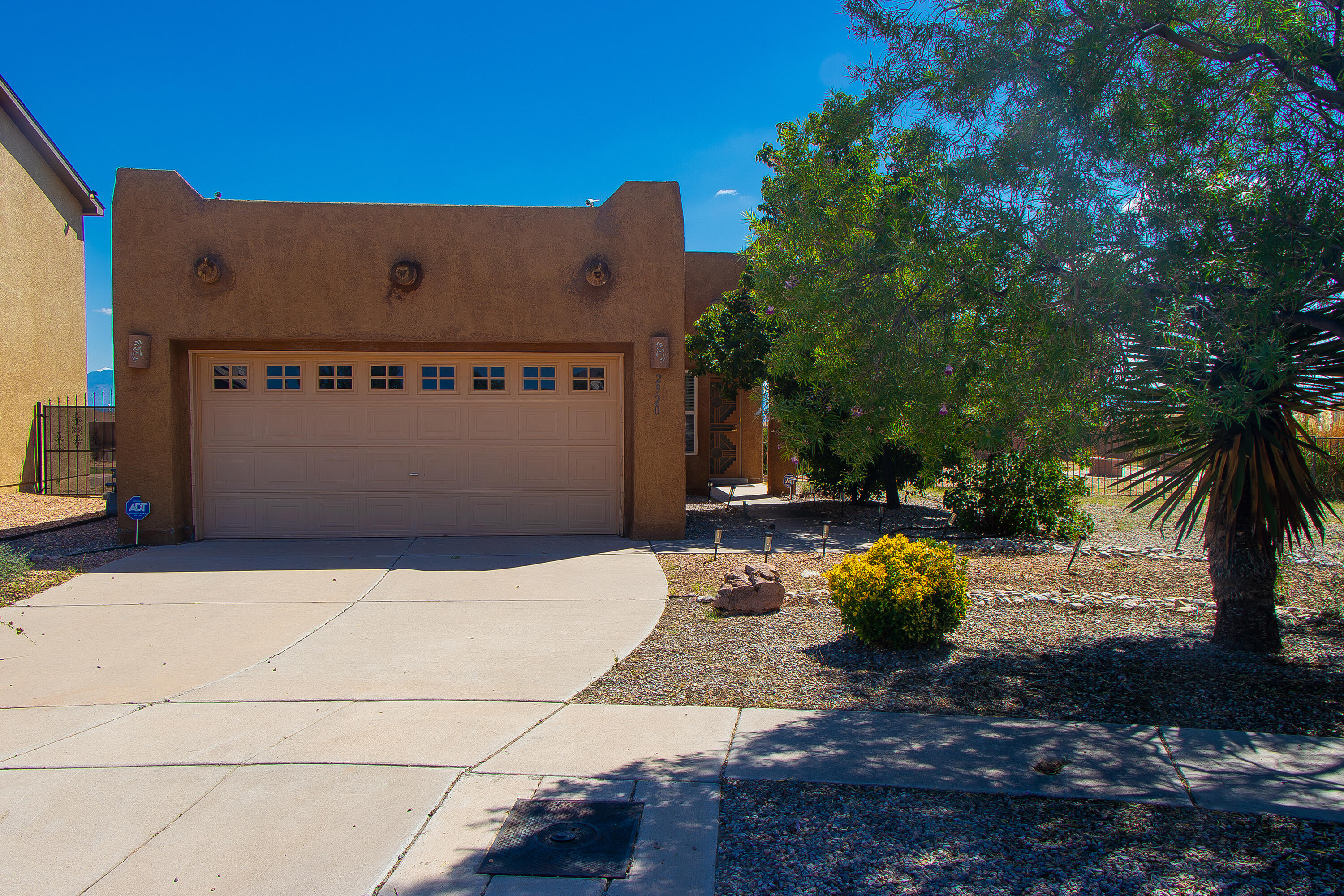 Nestled in an gated community, this stunning single-story home offers privacy, serenity, and views of the Sandia Mountains. Situated on an oversized lot, this residence boasts an expansive courtyard perfect for morning coffee or evening gatherings. Relax in the hot tub while enjoying the Sandia mountain, or entertain guests in your beautifully landscaped backyard. Come see your new home!