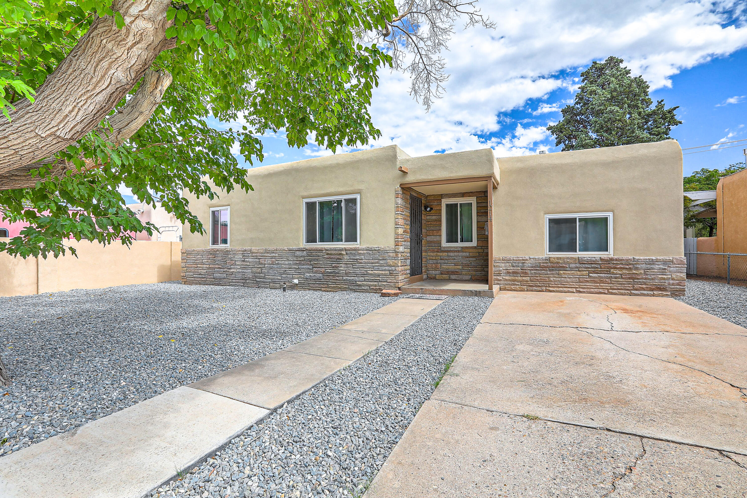 GORGEOUS AND CLASSIC CHARMER!  Come be amazed by this 3-bedroom, 1-bath home in Southeast Albuquerque, where classic design meets modern comfort. Nestled near San Mateo and Gibson, you'll enjoy easy access to shopping, schools, eats and drinks! Step inside to be greeted by a cozy living room with beautiful wood floors and abundant natural light, creating a warm and inviting atmosphere. The stunning kitchen boasts all-white cabinetry, stylish countertops and eye-catching backsplash, plus a bonus peaceful backyard view from your kitchen window. With well-maintained spaces, great location, a spacious fenced backyard including a lovely  shade tree, this move-in-ready gem is the perfect place to call home. Call today!