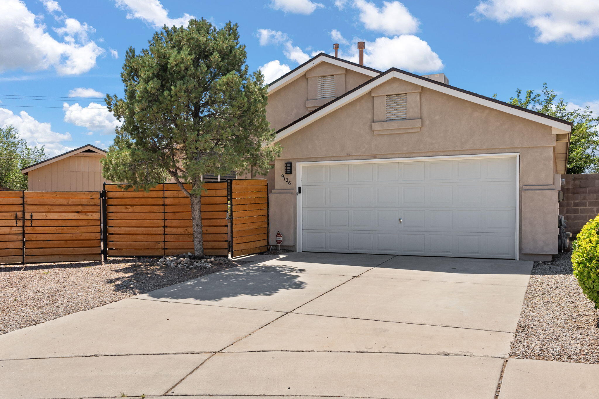 Welcome to your new dream home! This beautifully maintained 3-bed, 2-bath home offers the perfect blend of comfort, style, and functionality w/ ample space and natural light, ensuring a cozy retreat. A beautiful 518 sq ft addition is ready to transform into your dream space, wellness studio, gym, or home office. Equipped w/ 220v, plumbing, 2 mini splits, separate shower, and charming hardwood and tile floors. Benefit from peace of mind w/ a new roof (2023), freshly painted rooms and cabinets, w/ recent upgrades to the kitchen appliances. Unwind in the large, beautifully landscaped yard, a perfect outdoor oasis for relaxation, play, and entertaining. Gated RV parking provides secure and convenient storage for extra vehicles. This home is ready for you to move in and start making memories!