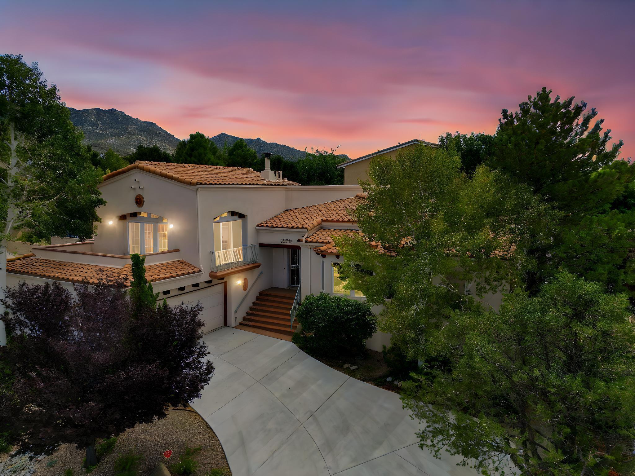 FOOTHILLS! CITY & MTN VIEWS! Nestled at the base of the Sandias, the OPEN SPACE is literally one of  your neighbors. This custom home built by Leslie Homes has been lovingly maintained and cared for by this original owner. This beauty offers two living areas. Large formal dining. Absolutely gorgeous updated kitchen offering granite counters, stainless steel appliances and wonderful breakfast area. Spacious Primary Suite with it's own office, FP, deck with City & Mtn VIEWS, and spa like bath with Jacuzzi tub. Two additional nice sized secondary bedrooms. Gorgeous landscaped backyard that will be your own oasis with wooden pergola & deck to take in the beauty of this private setting. 2 car garage with RV parking. Too many amenities to list. Steps from the OPEN SPACE & hiking/biking trails