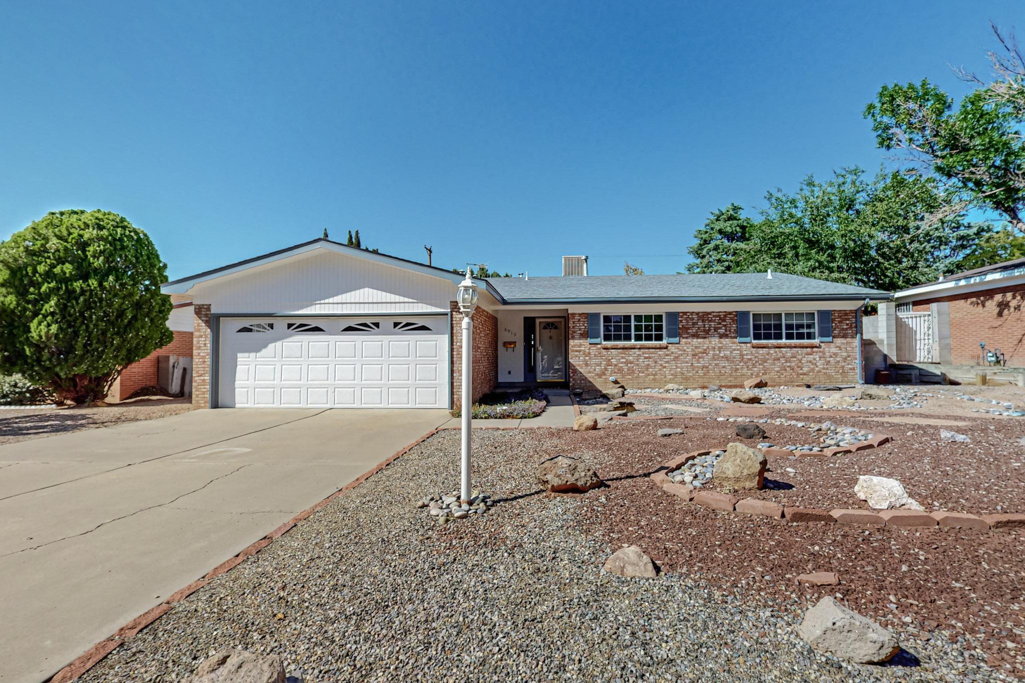 Welcome home! This spacious 4 bedroom, 3 bathroom gem offers the perfect blend of comfort and convenience. Recent upgrades include a swamp cooler in 2023, hardwood and tile throughout living spaces and carpet in the bedrooms.  The entire roof will be replaced mid - end of September. For peace of mind the home is equipped with a security system and security bars. The backyard has a non-chlorine hot tub that uses natural bromine for relaxing evenings along with a covered patio. This home is located just minutes from shopping and various activities.