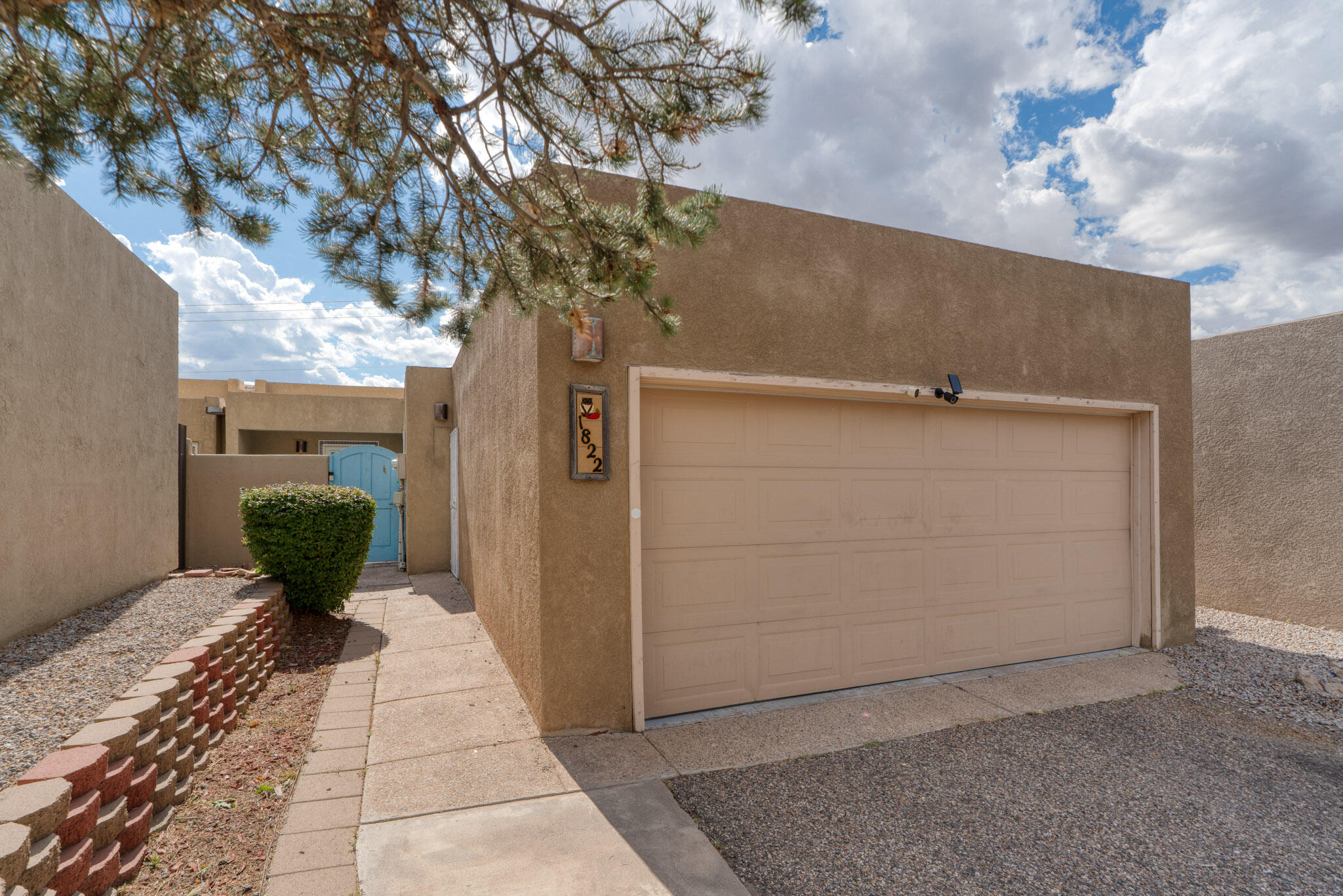 Nestled in Sandia Heights, this 3-bedroom, 2-bathroom single story gem offers stunning sunset views and 1,840 sqft of living space. Enjoy the 10' cedar plank ceilings, stainless steel appliances, and vinyl wood flooring. The den is plumbed for a potential additional bathroom. The master suite opens to a courtyard with turf (2022), and the finished garage offers extra storage and a newer motor (2023). Other highlights include granite countertops, walk-in closets, a covered patio, newer windows - AC/Furnace and TPO roof (2019). There is a very large flex room that looks onto the  courtyard that can be utilized as a media room, family room or a 3rd bedroom. This great property is located in the sought-after La Cueva school district, this home is a perfect blend of comfort & convenience!