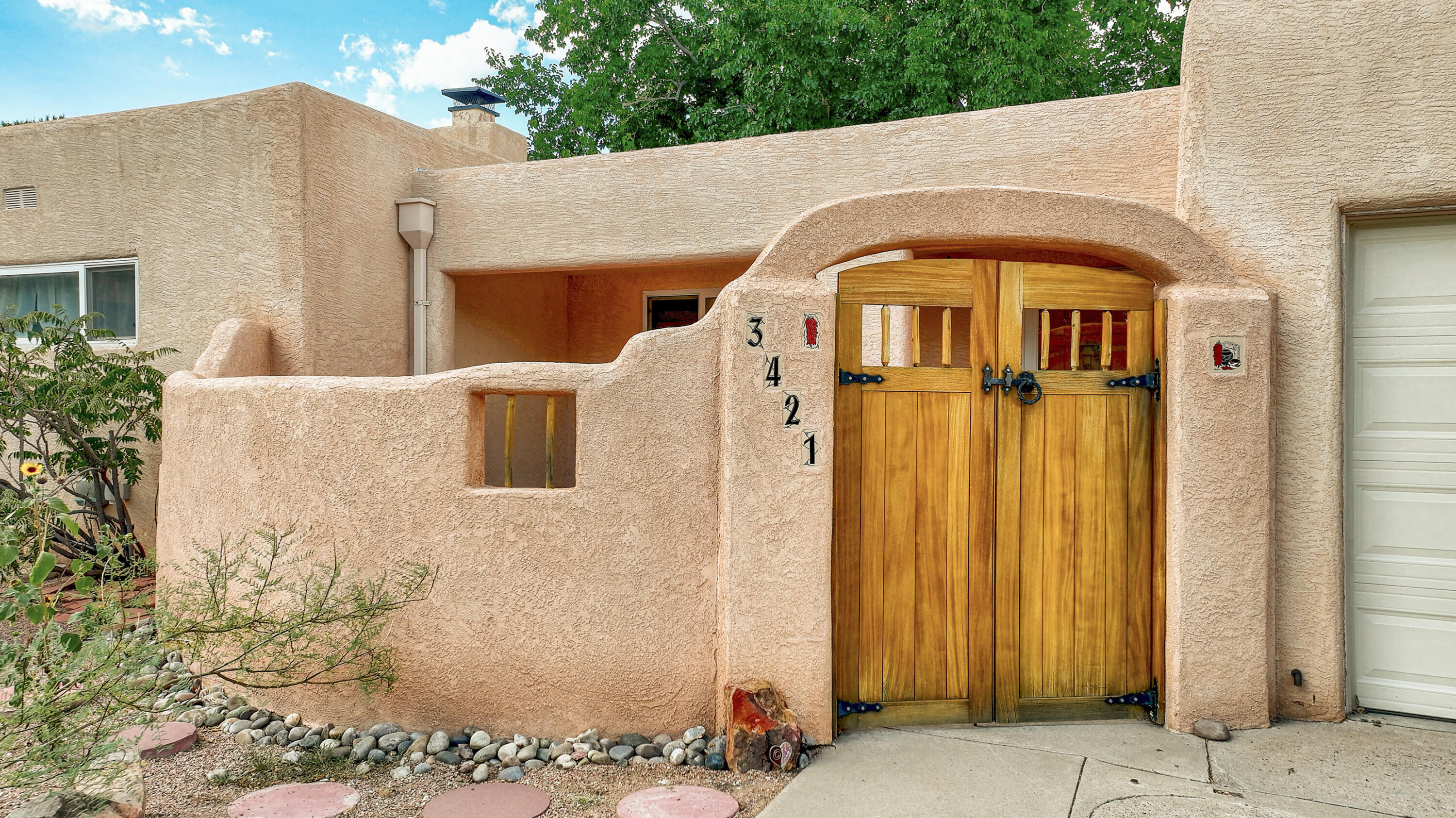 A Modern Sanctuary Near UNM.Nestled in a prime location just steps away from the University of New Mexico and the vibrant downtown, this sw style residence offers a harmonious blend of modern aesthetics and functional design.A welcoming courtyard entrance sets the tone for a serene retreat. Inside, gleaming hardwood floors guide you through the spacious living room, where natural light streams through large windows & skylights. The gourmet kitchen, featuring soaring ceiling-height cabinetry and sleek countertops, is a culinary enthusiast's dream.The thoughtfully designed floor plan includes two generously sized living areas, providing ample space for entertaining guests or simply relaxing.