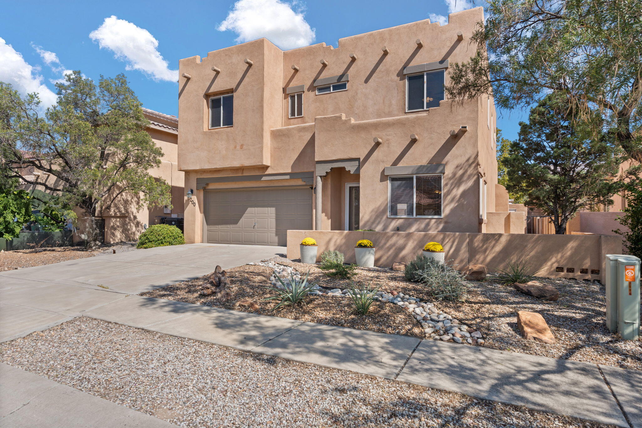 **OPEN HOUSE: 9/21 12pm-2pm, 9/22 1pm-3pm** Welcome home to this light-filled gem in Vista Del Norte, offering a perfect blend of style & comfort. The spacious living room welcomes you w/ a cozy gas fireplace, leading to the open kitchen featuring subway tile backsplash, recessed lighting, a large pantry, and a nook for casual dining. Upstairs, laminate wood flooring extends through the loft & bedrooms, including a primary suite with a sitting area, walk-in closet, and private balcony with mountain views.  Refrigerated air & newer furnace, all appliances stay! NEW (2024) washer/dryer.  Step out to your large backyard, complete with a covered patio & storage shed...just awaiting your personal touch.  Close to parks, trails, and perfect for Balloon Fiesta views!