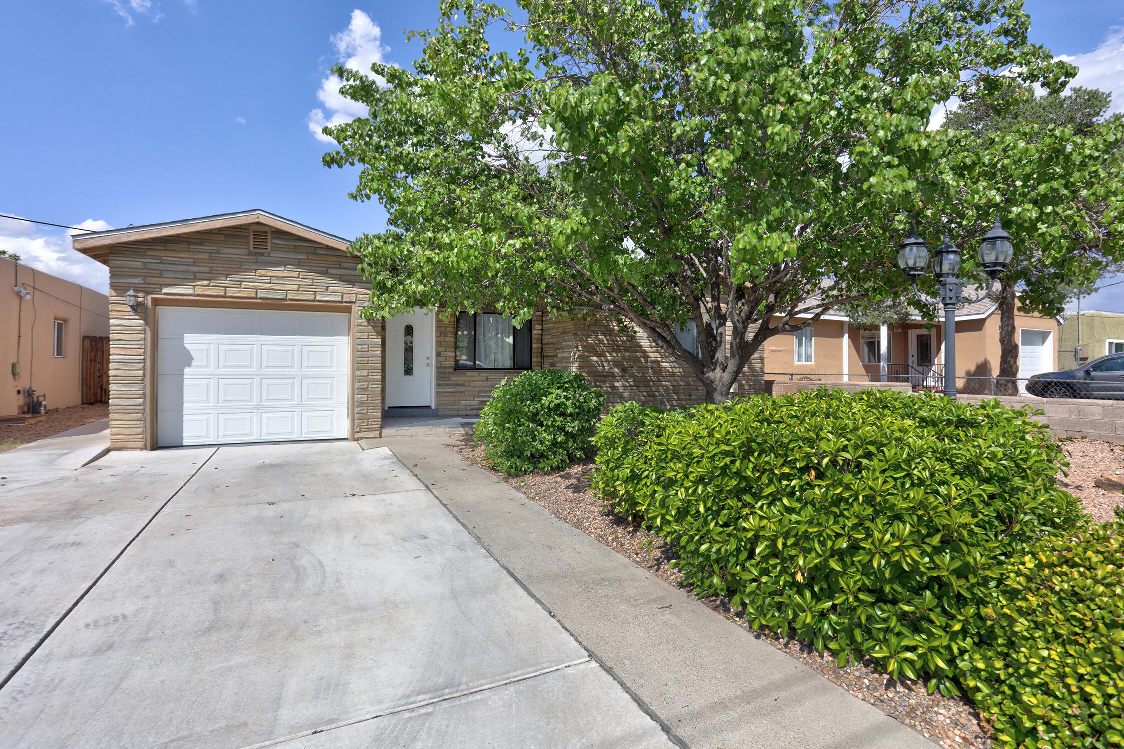 This beautifully renovated property offers a spacious kitchen and dining room combo, perfect for family meals and entertaining. The separate living area provides a cozy and comfortable space to unwind, and the convenience of an indoor laundry room is an added bonus. A one-car finished garage offers ample storage and parking.Enjoy the comfort of refrigerated air and take in stunning mountain views from the front of the house. The yard is meticulously landscaped with a large backyard featuring beautiful trees and outdoor storage, ideal for outdoor activities or relaxing in nature. Newer light fixtures throughout the home add a modern touch.Located just minutes from hospitals, downtown entertainment, and with easy access to the freeway, this home offers a prime location for convenien