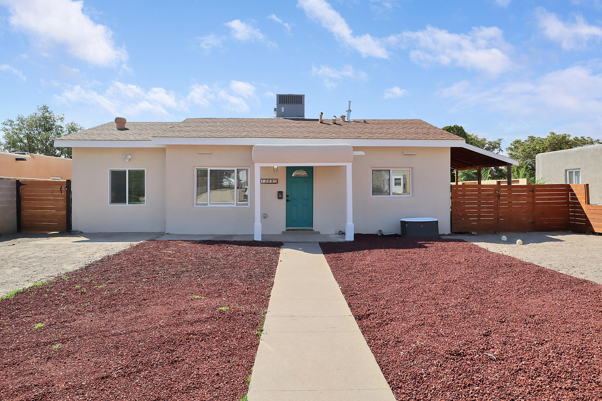 Welcome to a beautifully remodeled property in convenient Northeast Albuquerque neighborhood with views of the Sandia mountains and modern upgrades throughout. A newly added primary bedroom suite provides a serene retreat, complete with a luxurious master bath. The entire home features brand new flooring and is painted in beautiful neutral tones, offering a fresh and inviting ambiance. The cozy kitchen has been fully updated with new appliance package, backsplash, fixtures and granite countertop. Electrical wiring has been updated throughout including new panel. New sewer lines ensure peace of mind for years to come. Located close to Kirtland Air Force base, hospital, restaurants and shopping, this home combines convenience with comfort. Don't miss this exceptional opportunity!!